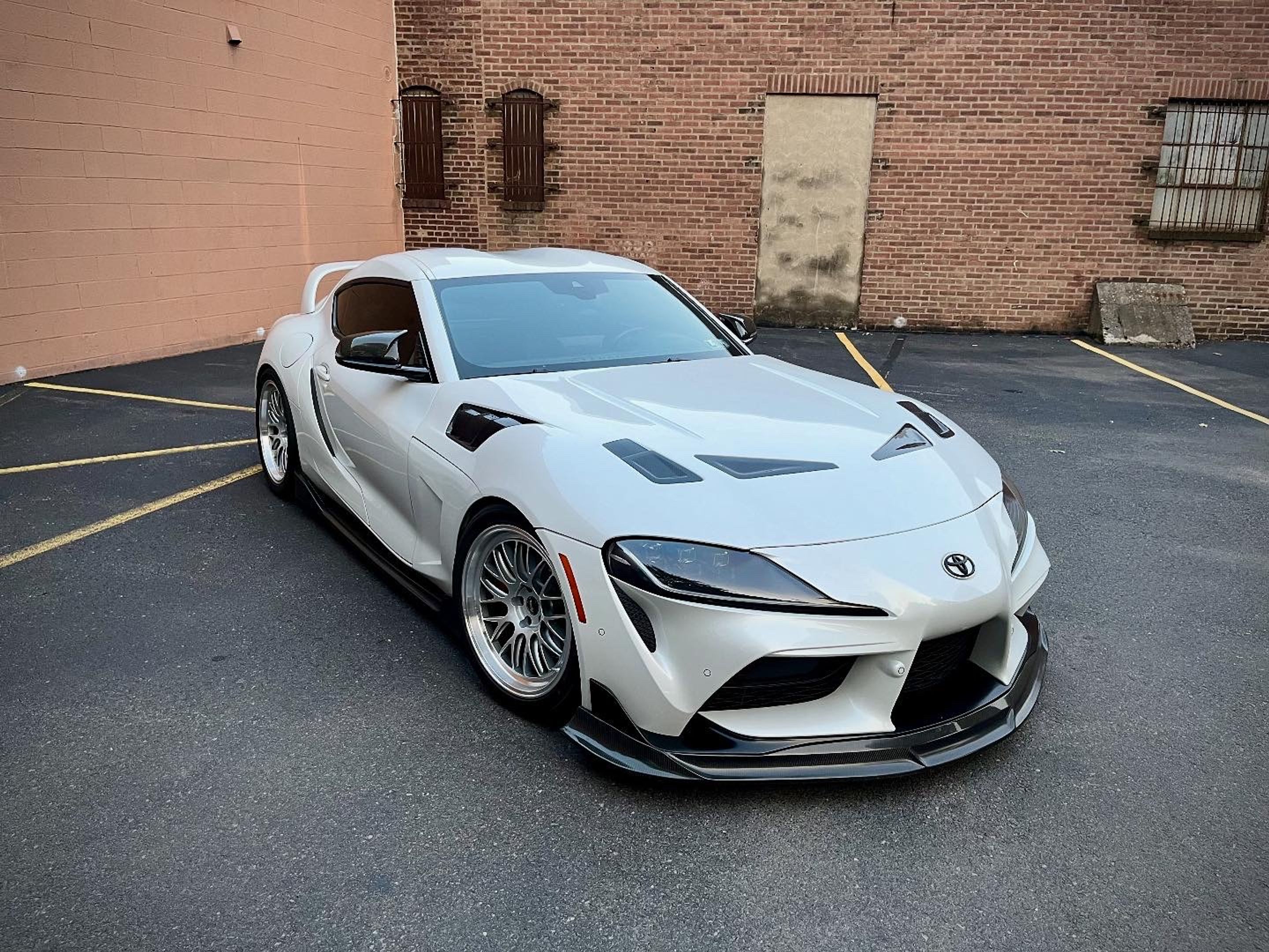 White Toyota GR Supra with 19" ML-10RT Apex wheels in Machined Lip Race Silver