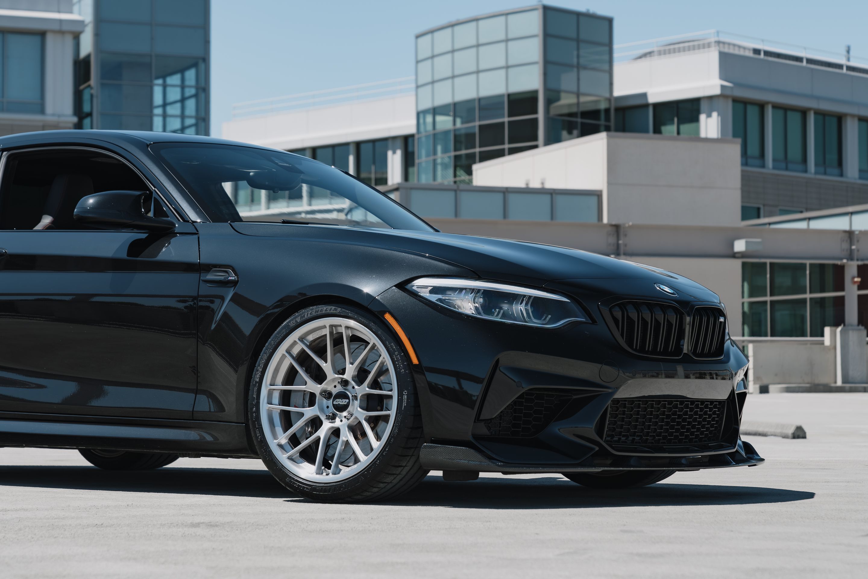 Black BMW F87 M2 with 19" ARC-8RT Apex wheels in Brushed Clear