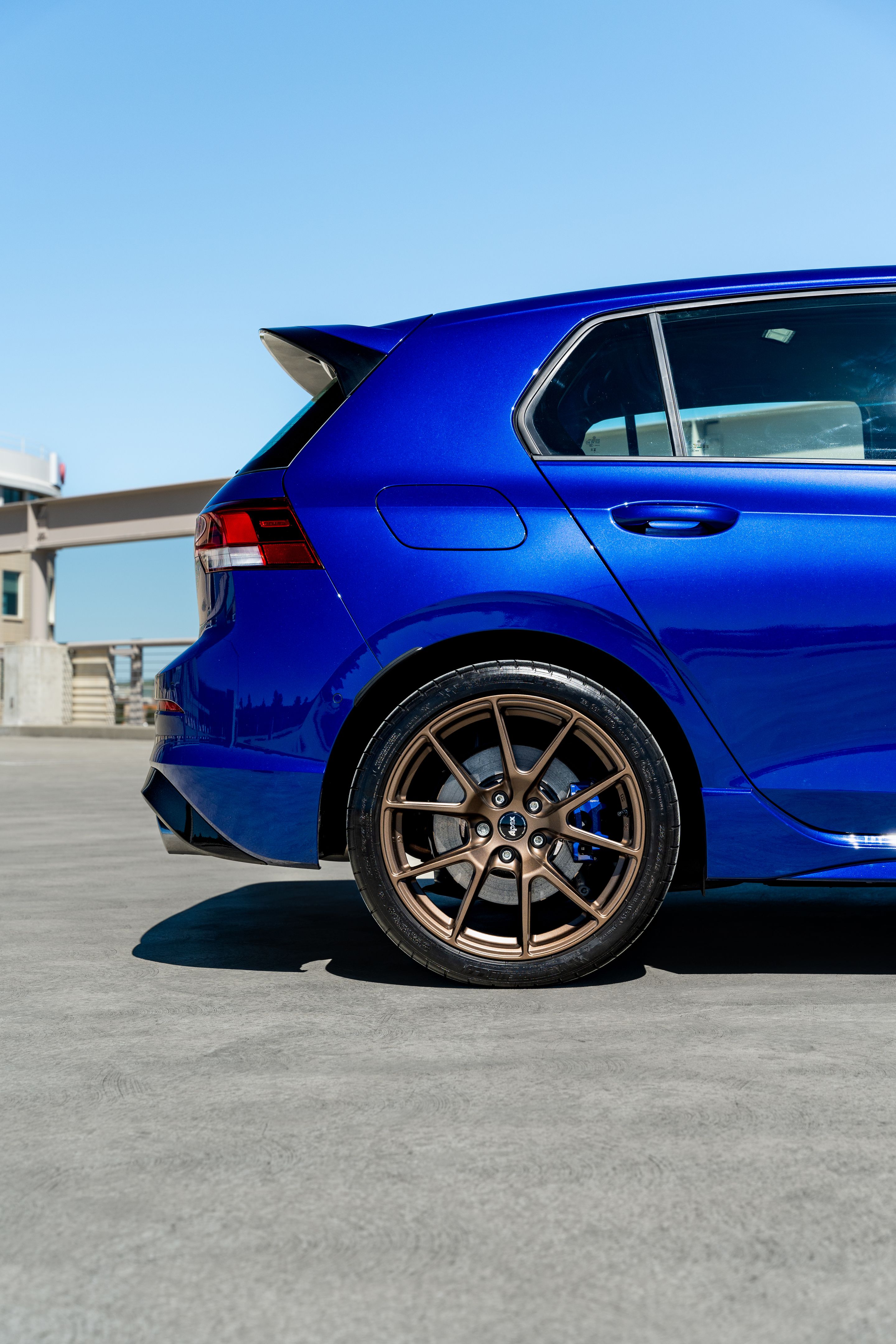 Blue VW MK8 Golf R with 18" VS-5 Apex wheels in Satin Bronze