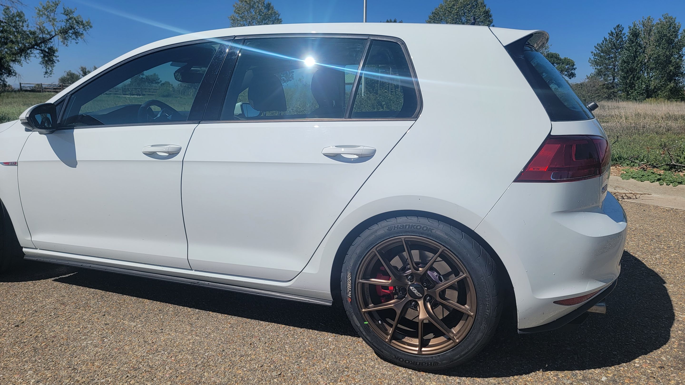White VW MK7 GTI with 17" VS-5RS Apex wheels in Satin Bronze