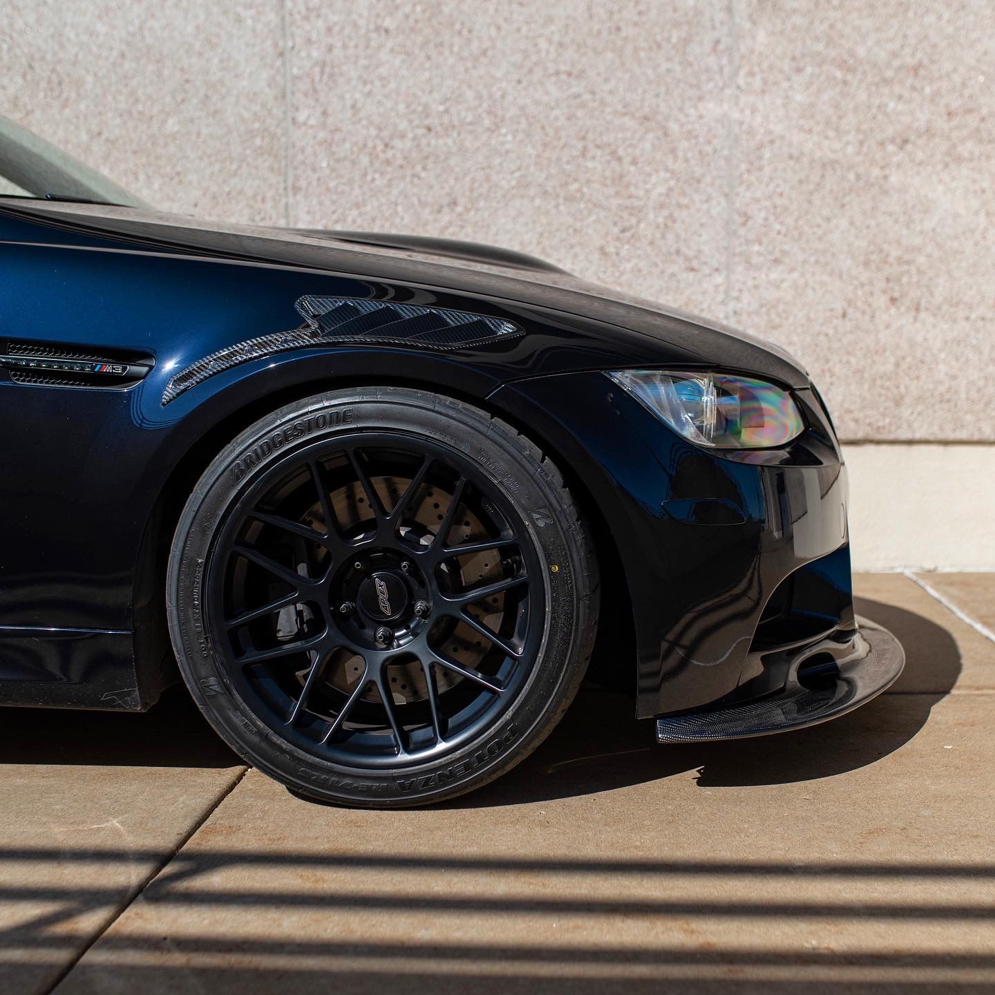 Black BMW E90 Sedan M3 with 18" ARC-8 Apex wheels in Satin Black