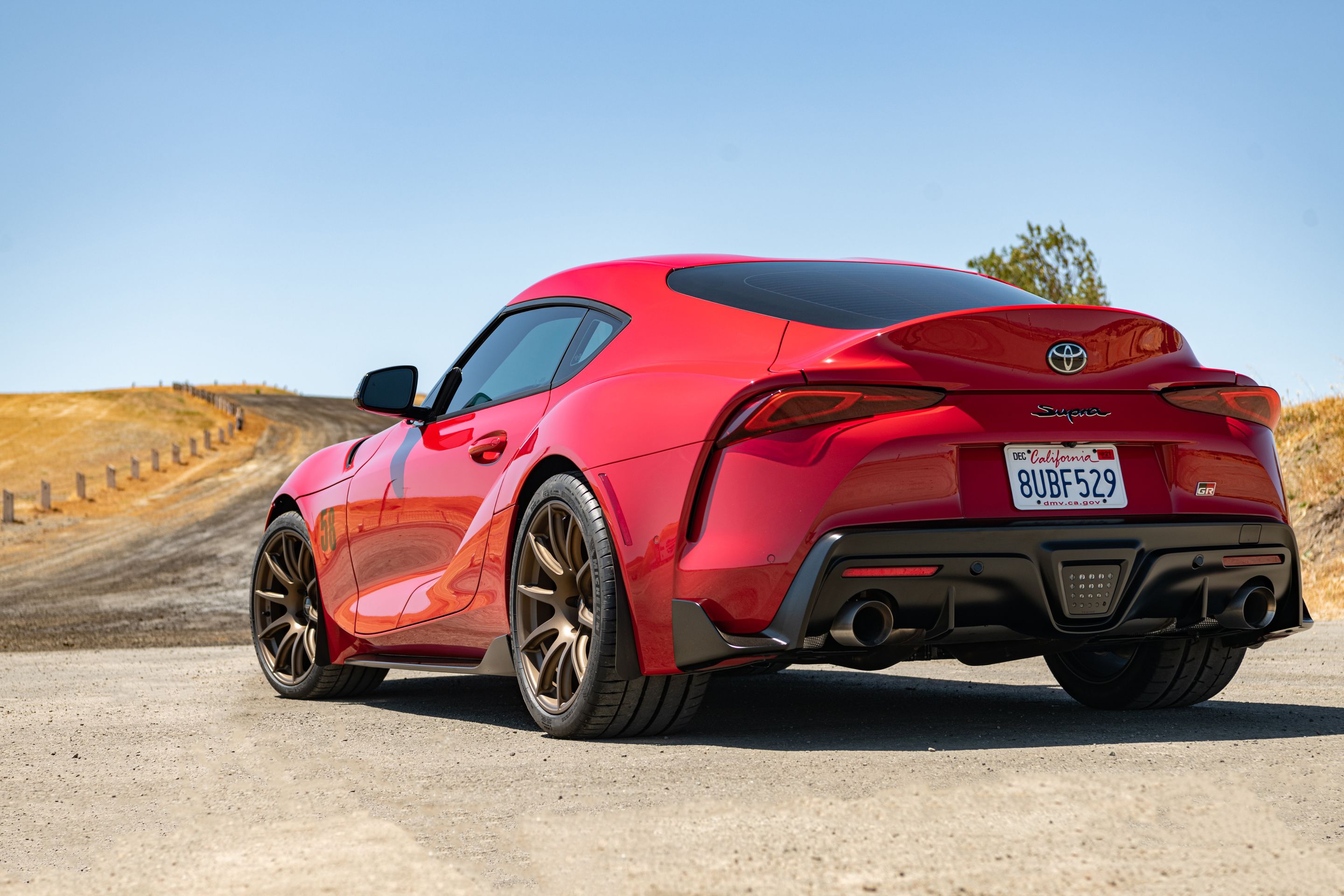 Red Toyota GR Supra with 19" SM-10 Apex wheels in Satin Bronze