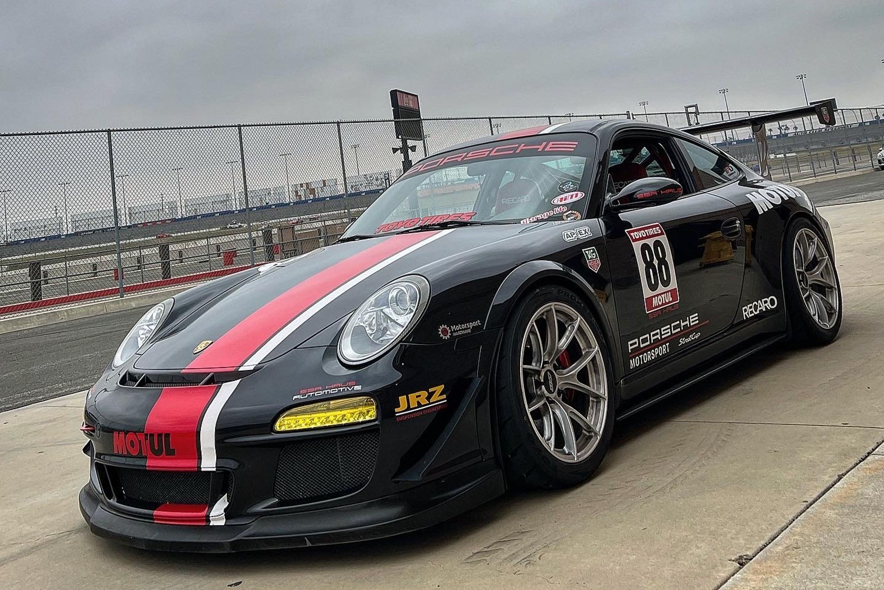 Black Porsche 911 997 Carrera S with 18" VS-5RS Apex wheels in Brushed Clear