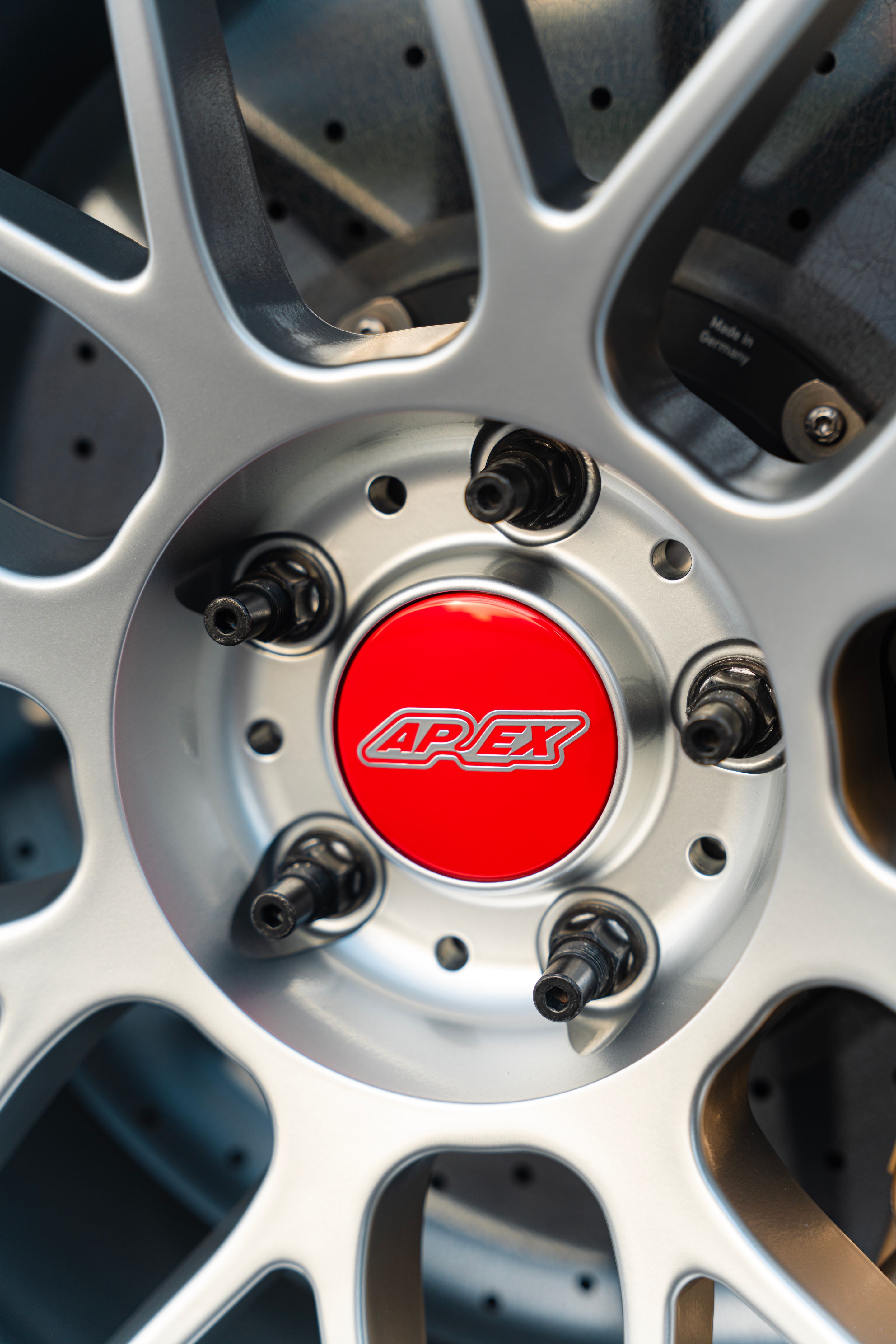 Red BMW F82 Coupe M4 with 19" ARC-8 Apex wheels in Hyper Silver