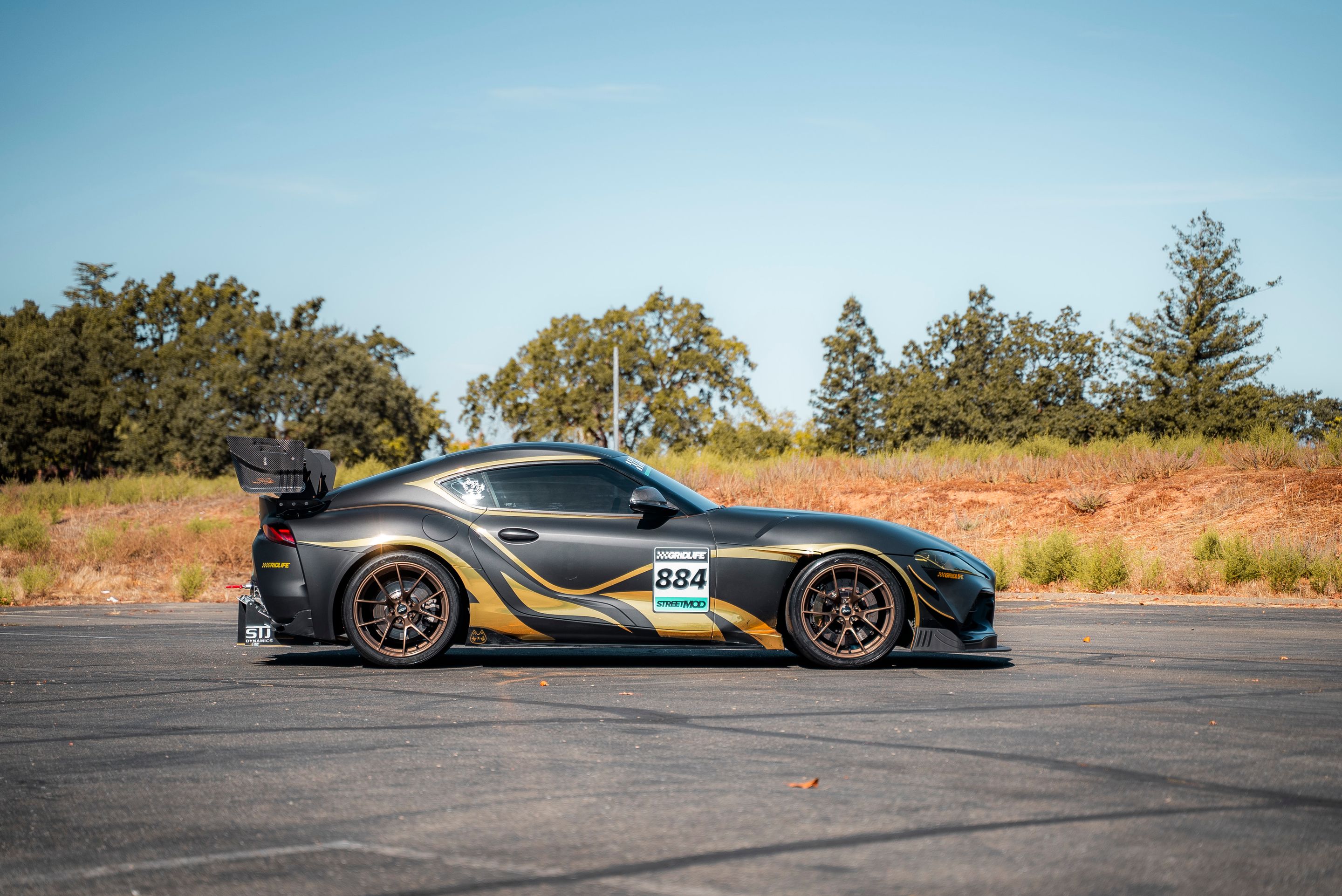 Grey Toyota GR Supra with 19" VS-5RS Apex wheels in Satin Bronze