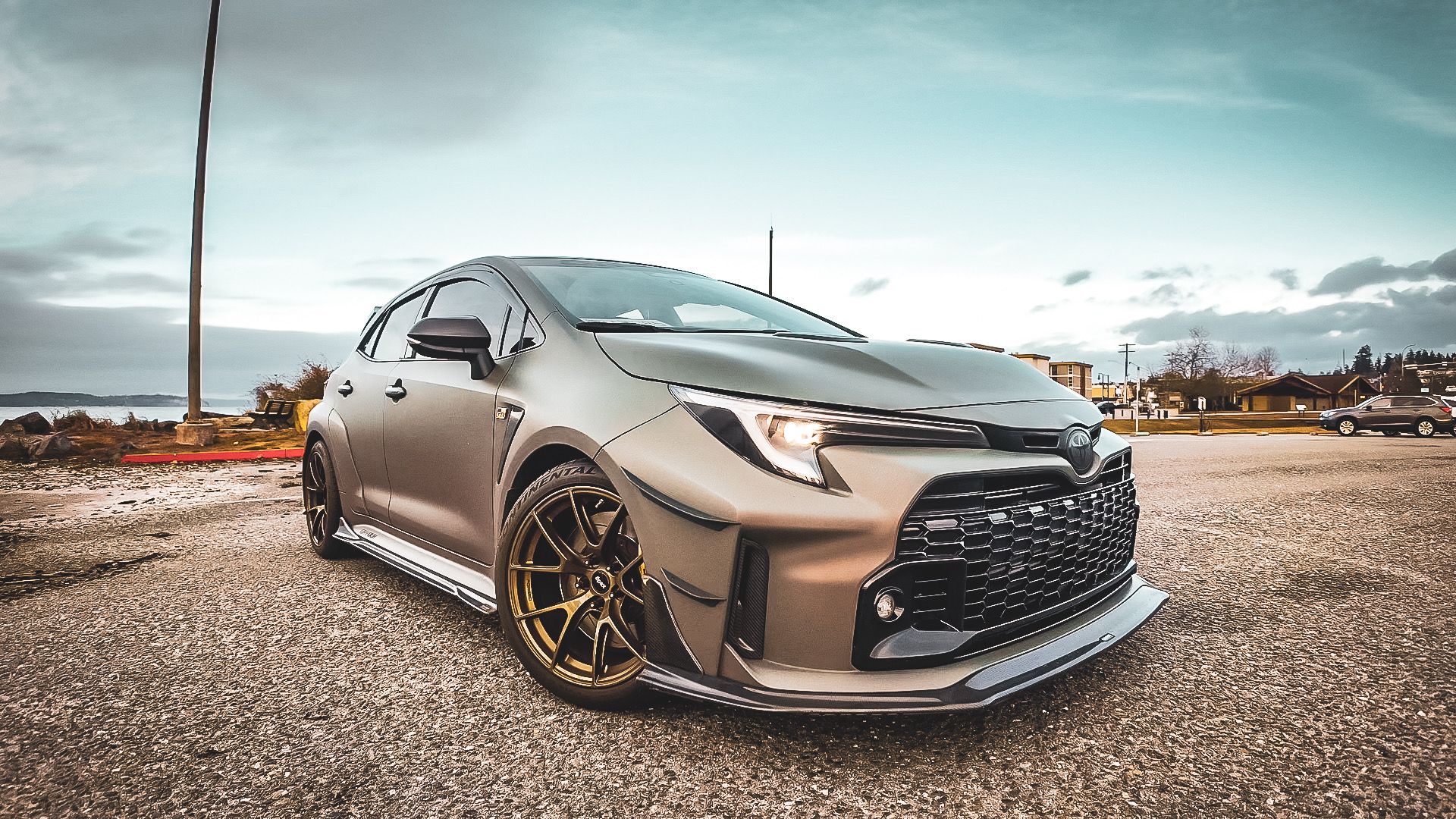 Green Toyota GR Corolla with 18" VS-5RS Apex wheels in Satin Bronze