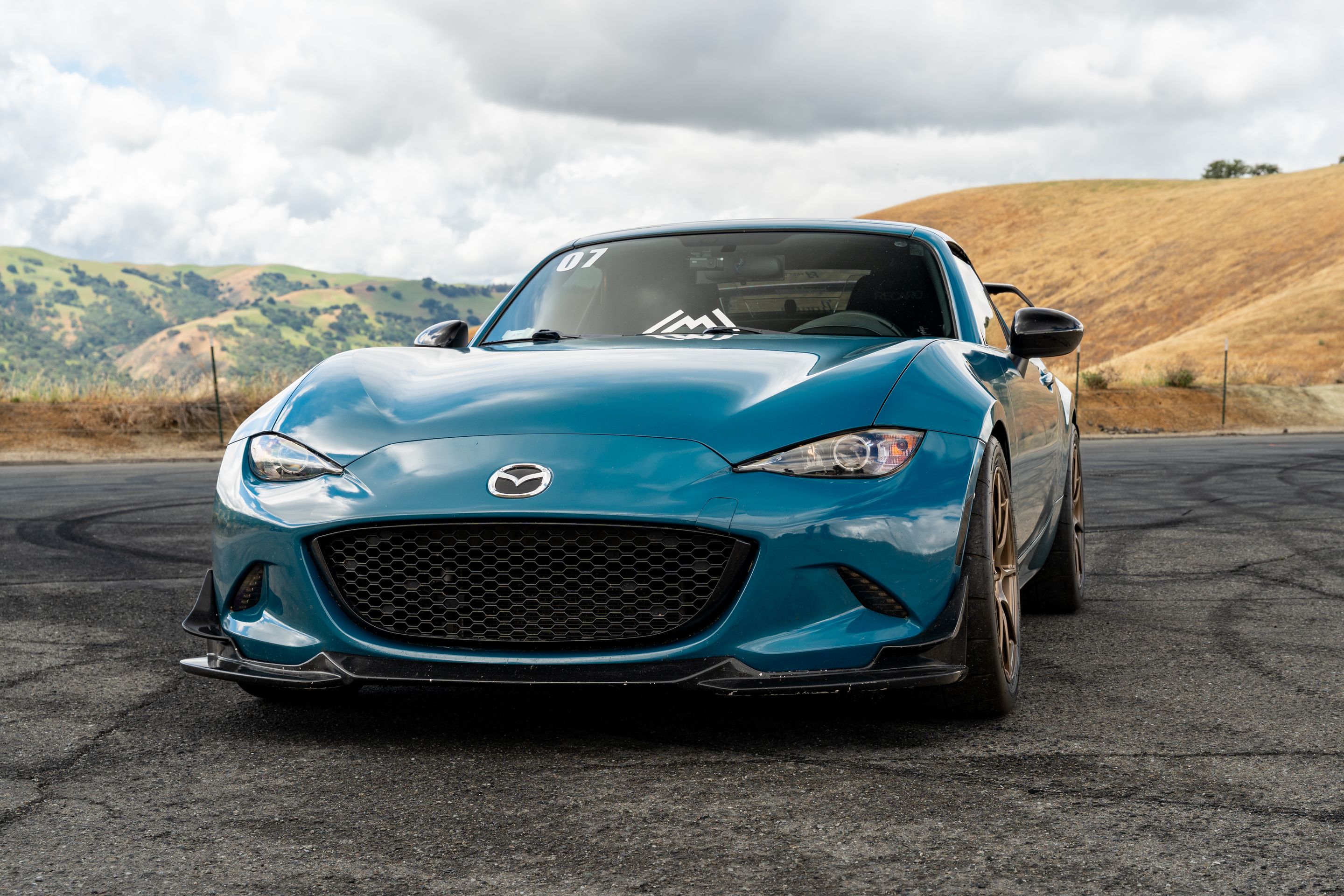Blue Mazda ND MX-5 Miata with 17" SM-8RS Apex wheels in Satin Bronze