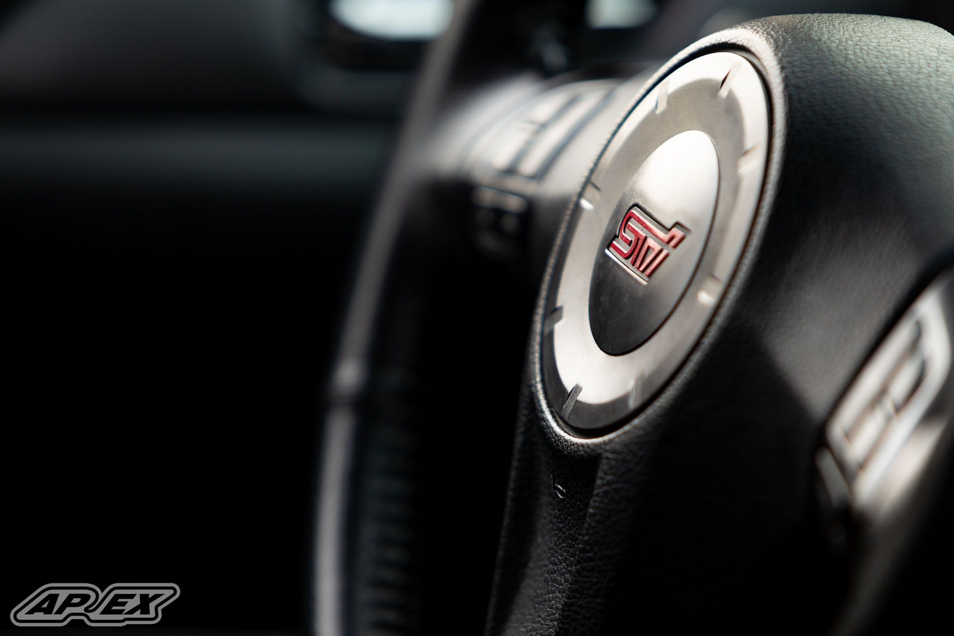 Orange Subaru GR WRX STI with 18" EC-7 Apex wheels in Satin Black