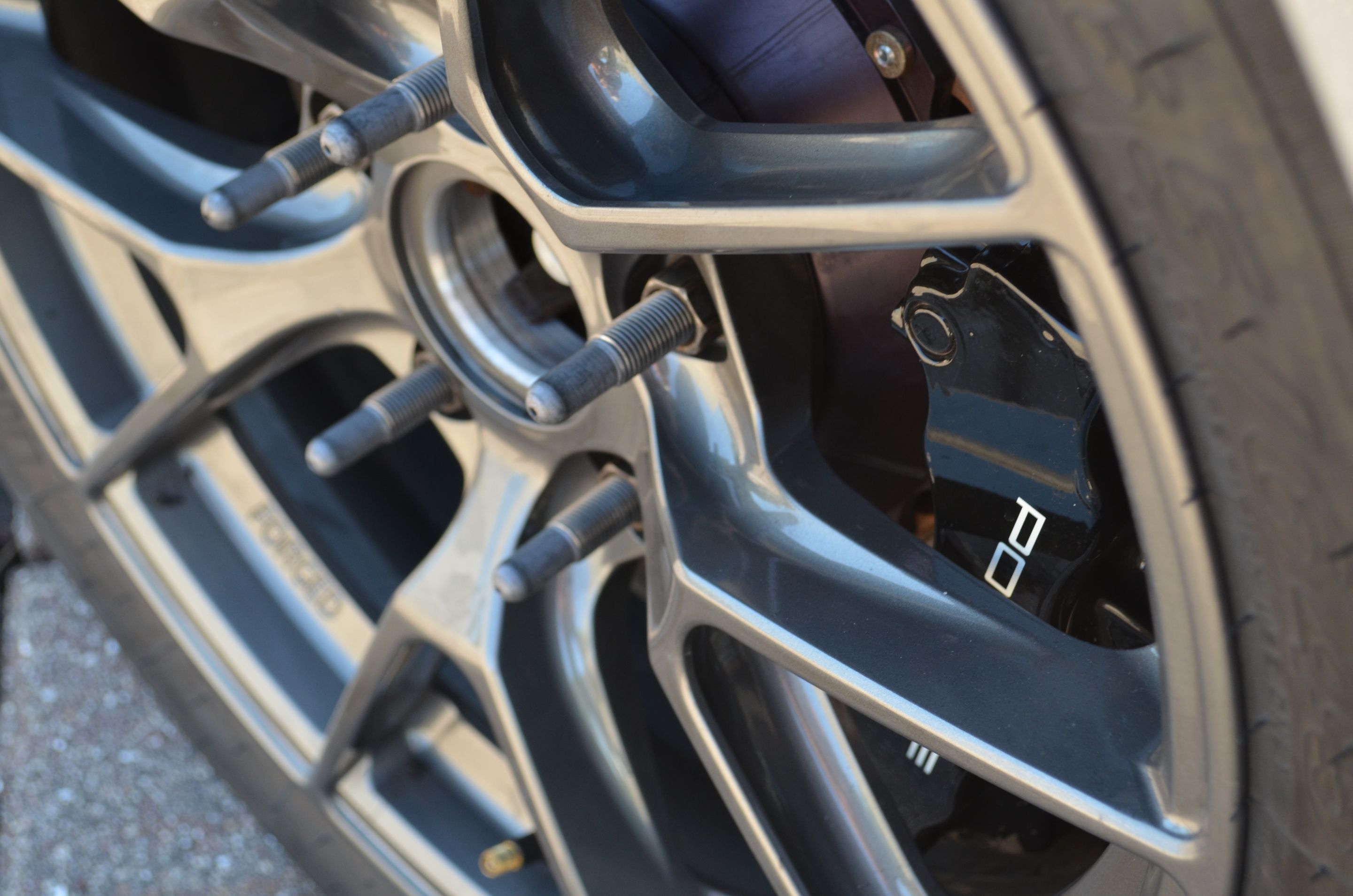 Grey Porsche 718 Cayman GT4 with 18" VS-5RS Apex wheels in Anthracite