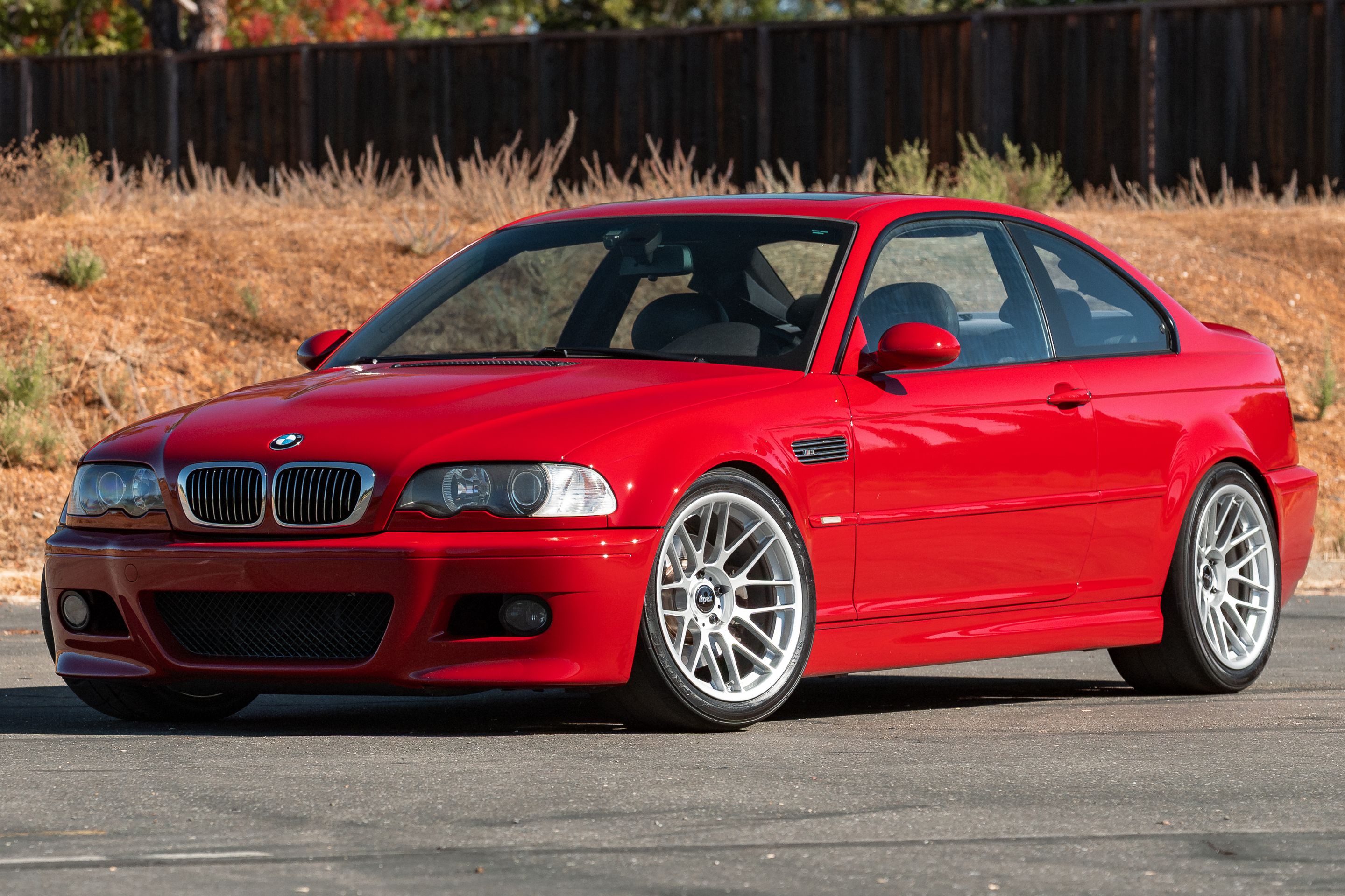 Red BMW E46 M3 with 18" ARC-8RT Apex wheels in Race Silver