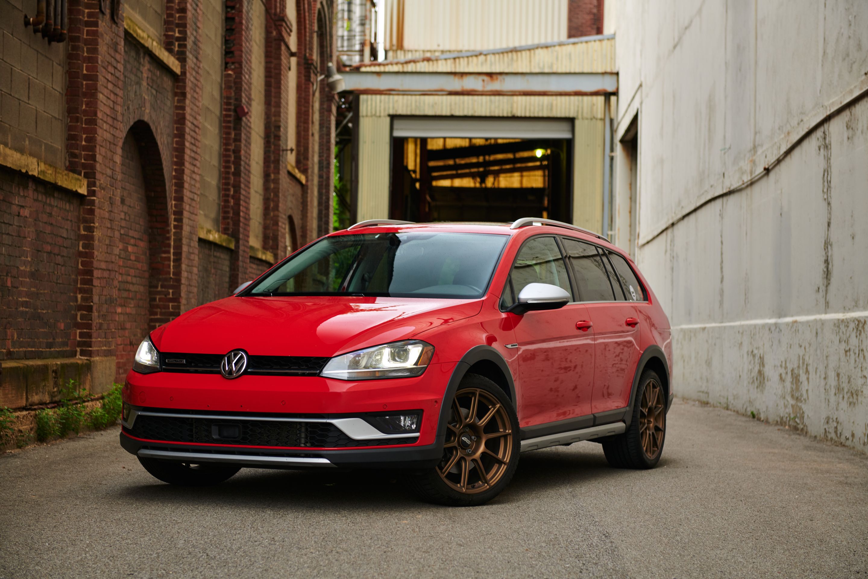 Red VW MK7 Alltrack/SportWagen Alltrack with 18" SM-10 Apex wheels in Satin Bronze