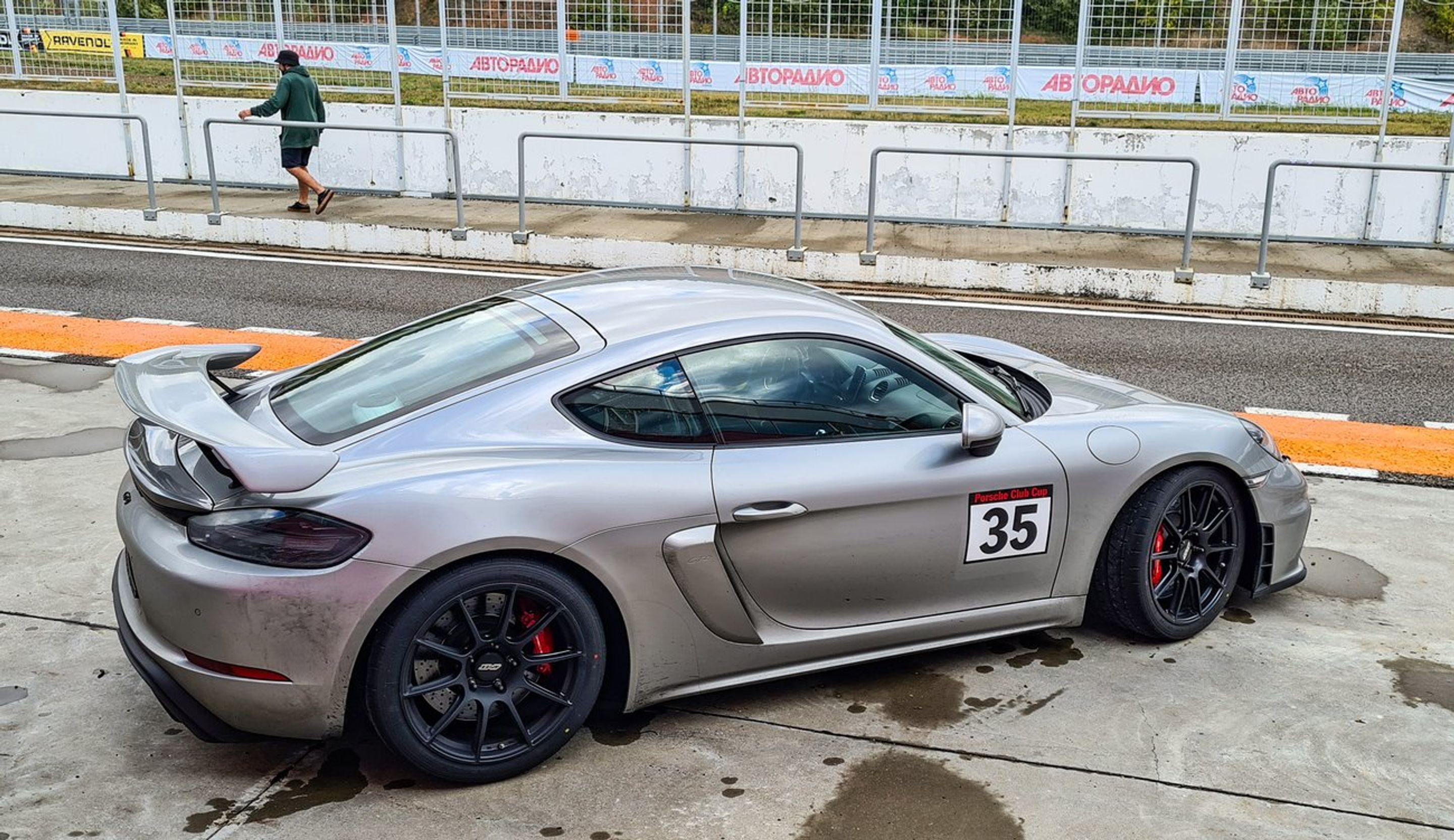 Silver Porsche 718 Cayman GT4 with 19" SM-10 Apex wheels in Satin Black