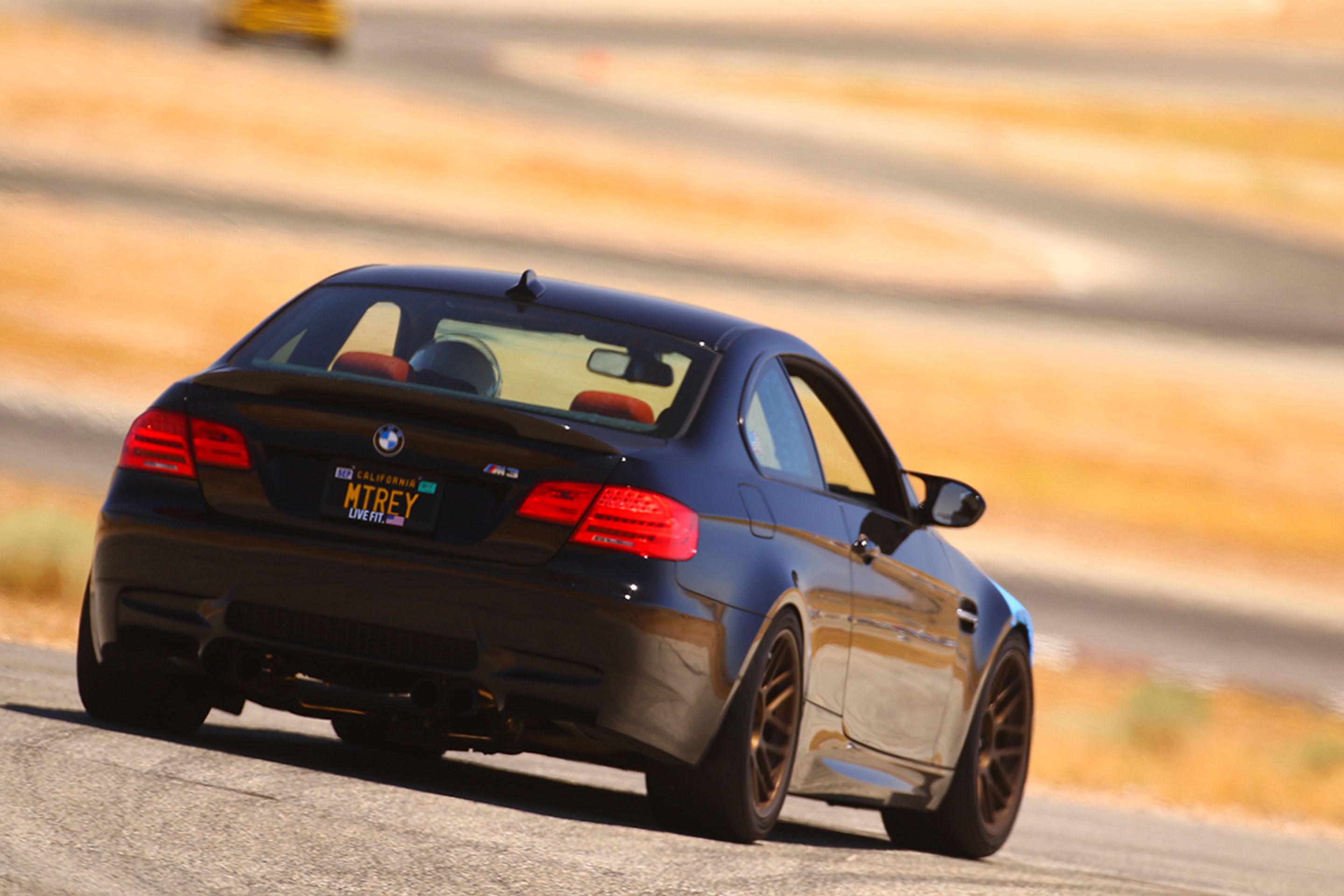 Black BMW E92 Coupe M3 with 18" ARC-8 Apex wheels in Satin Bronze