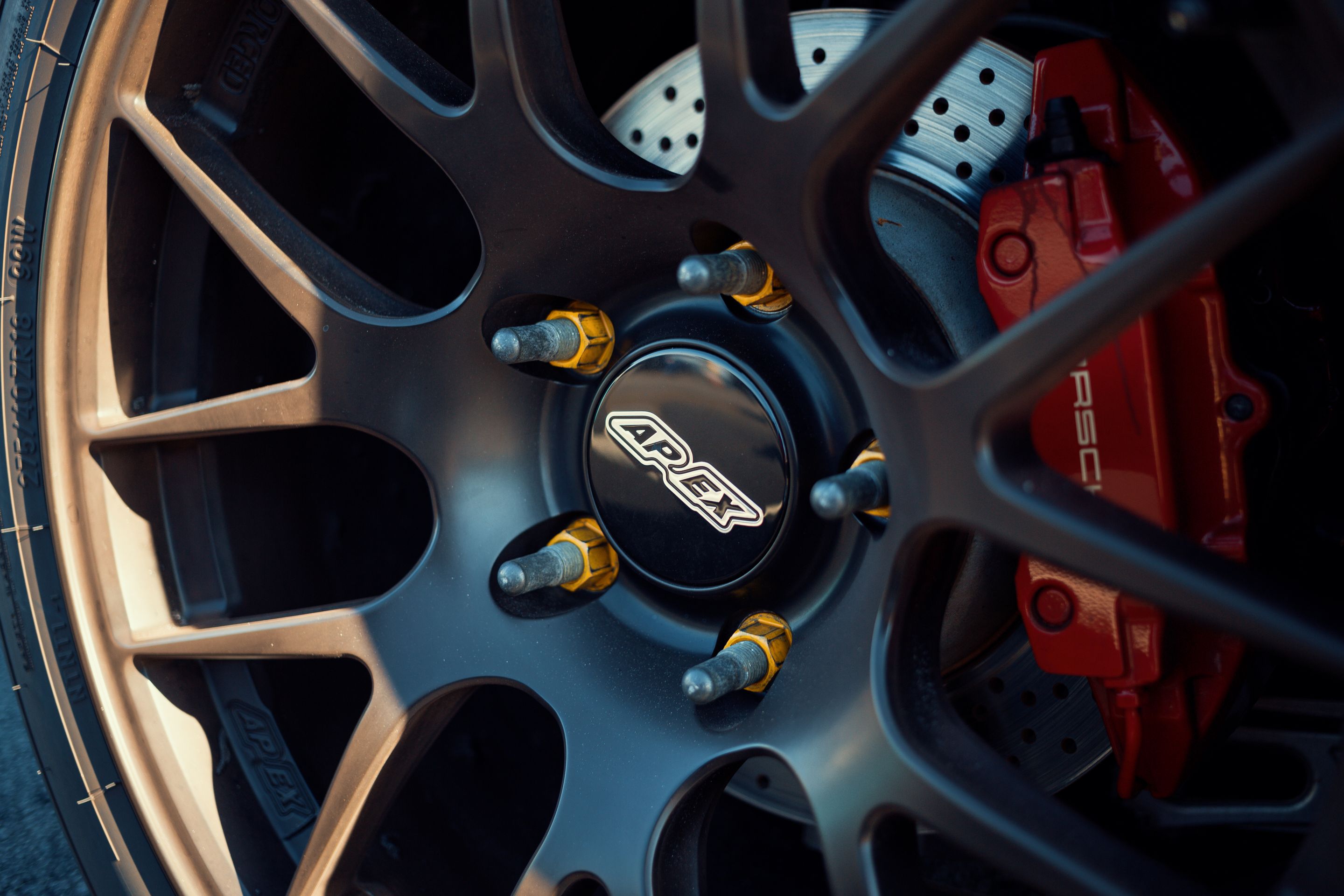 Red Porsche 981 Cayman S with 18" EC-7R Apex wheels in Satin Black