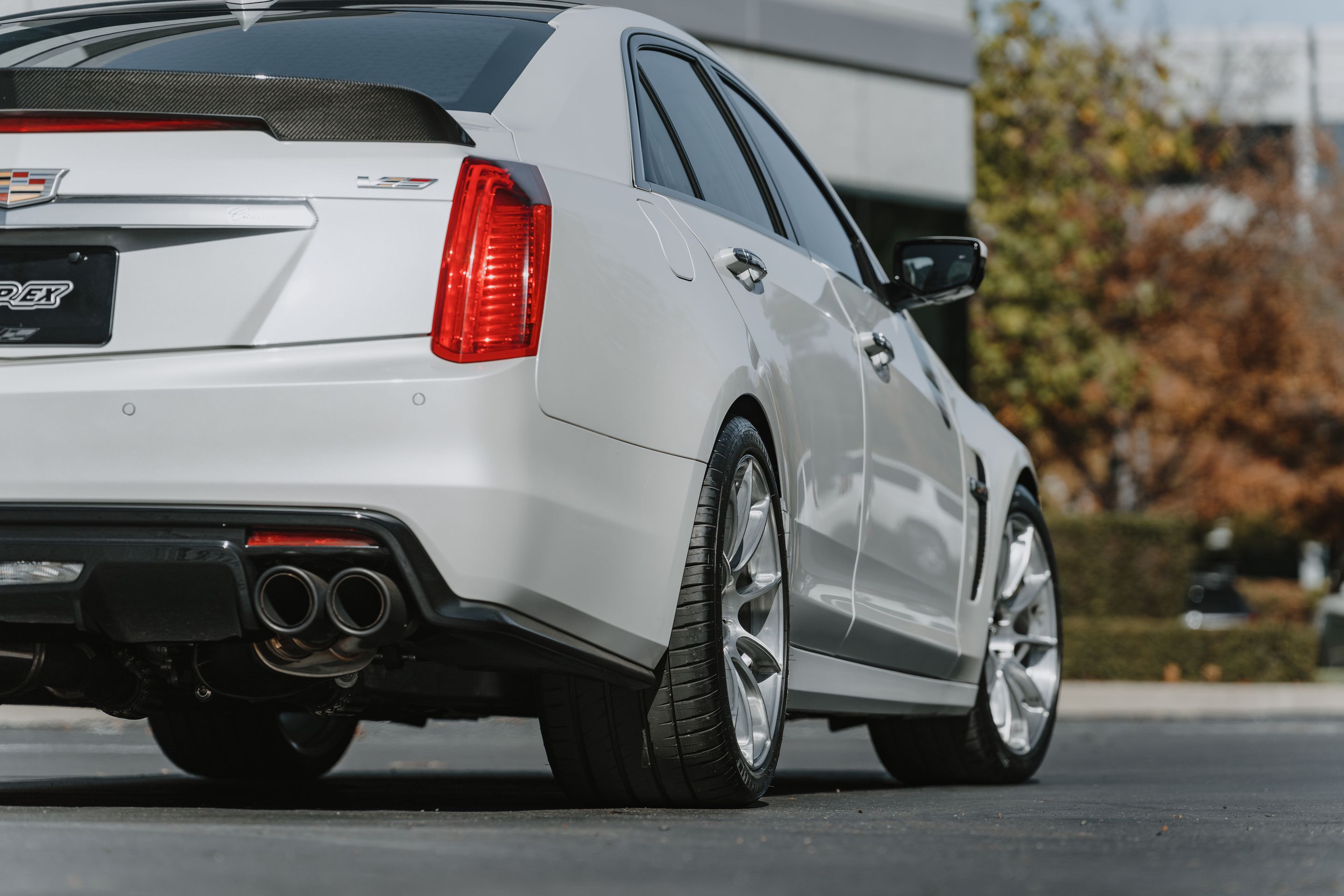 White Cadillac Gen 3 CTS-V with 19" SM-10RS Apex wheels in Brushed Clear