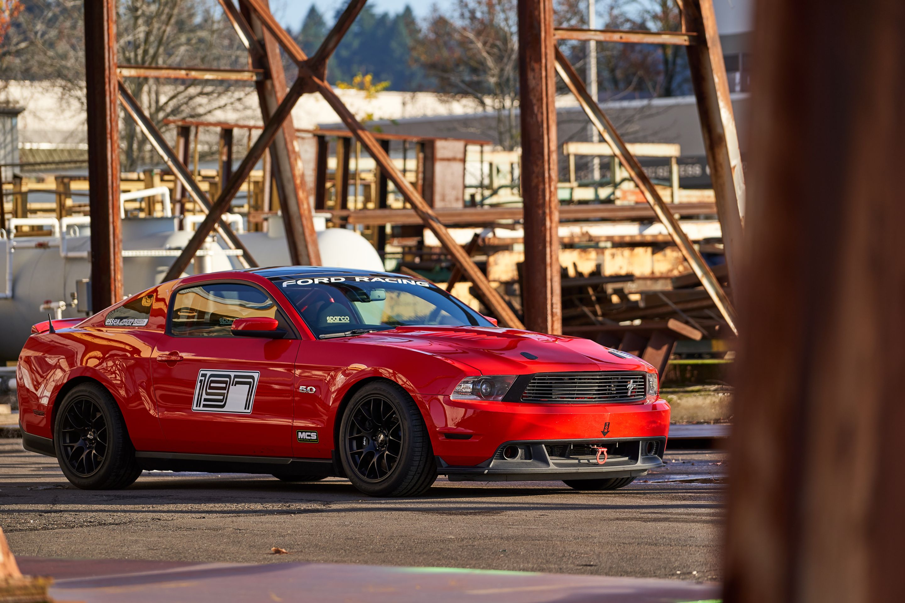 Red Ford S197 Mustang GT with 18" EC-7 Apex wheels in Satin Black