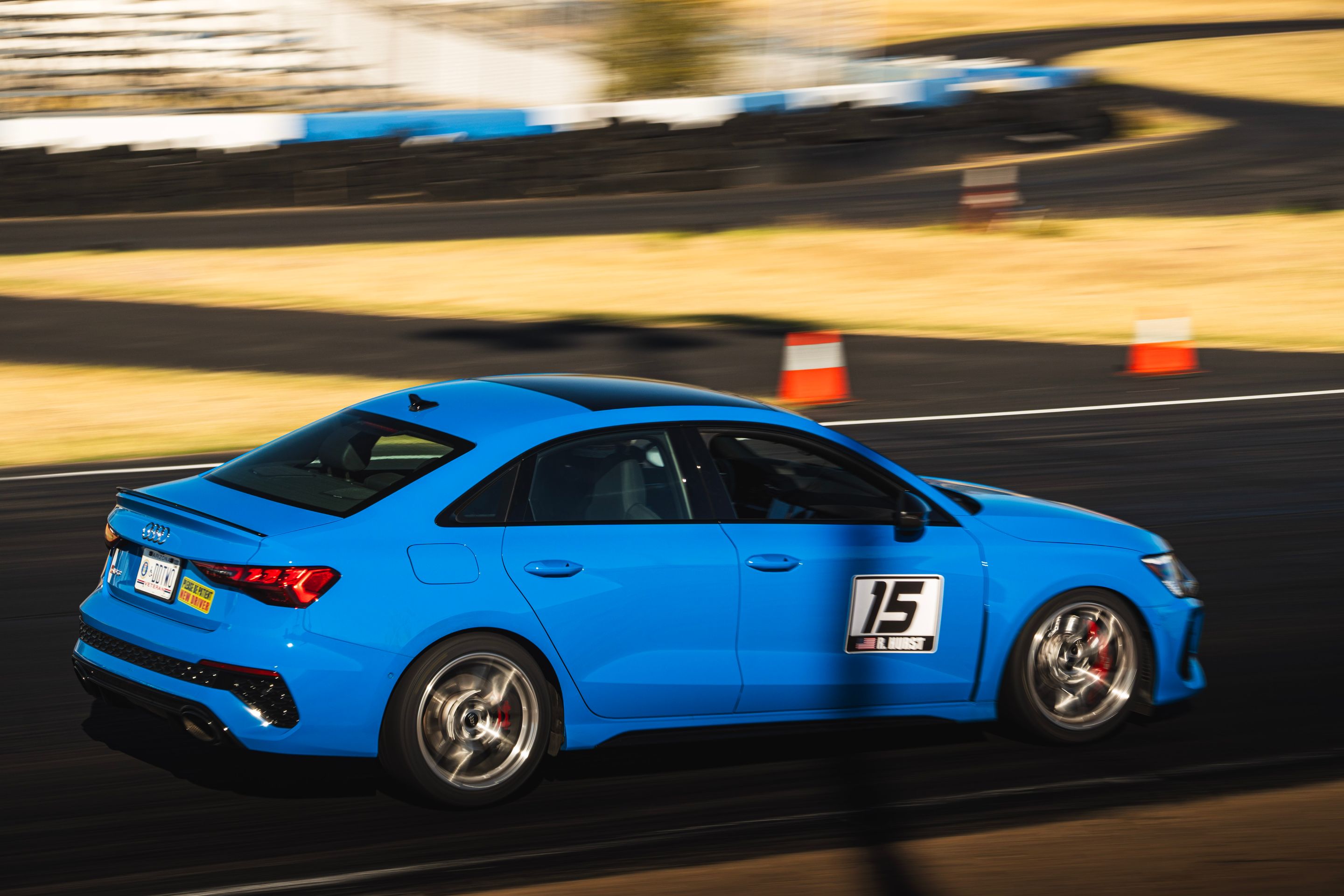 Blue Audi 8Y RS 3 with 18" VS-5RS Apex wheels in Brushed Clear