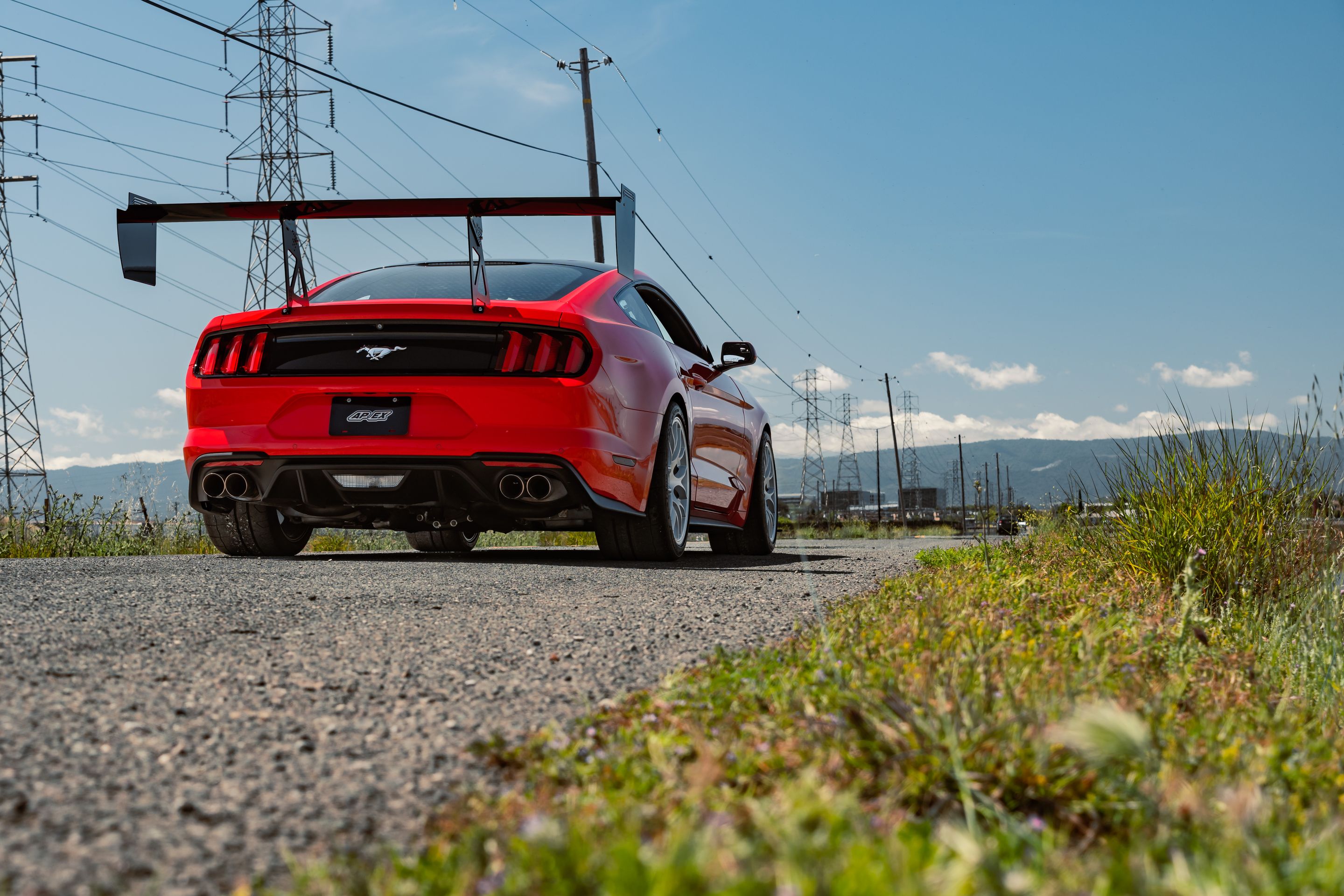 Red Ford S550 Mustang GT with 19" EC-7 Apex wheels in Race Silver