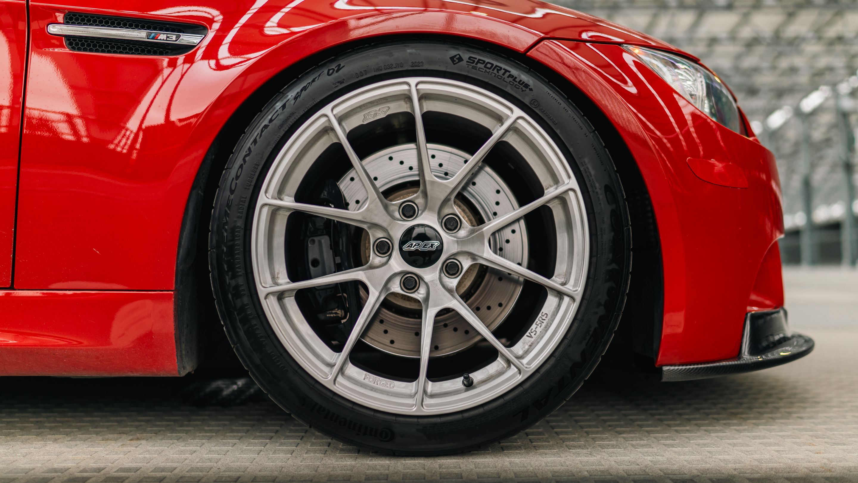 Red BMW E90 Sedan M3 with 18" VS-5RS Apex wheels in Brushed Clear