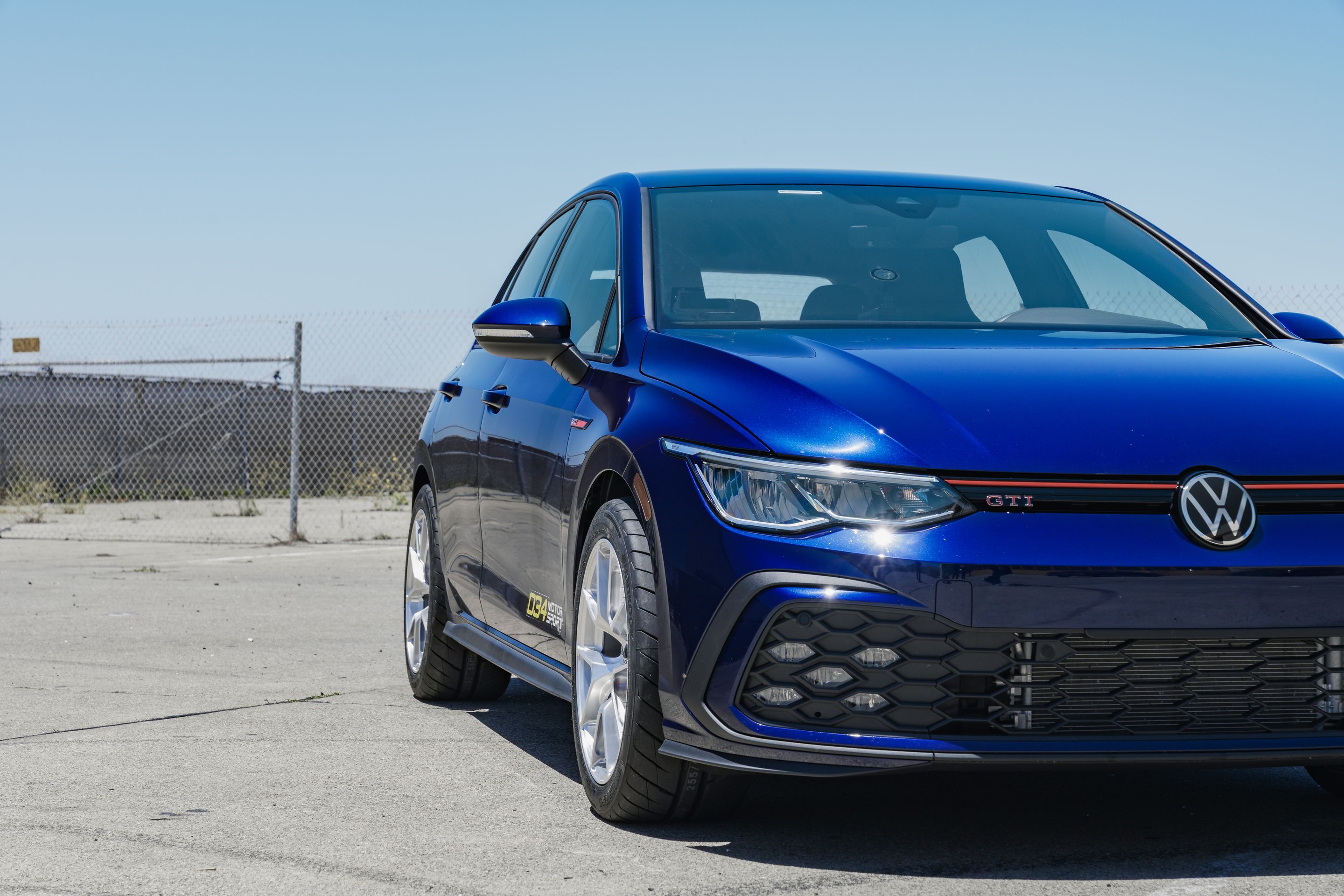 Blue VW MK8 GTI with 17" VS-5RS Apex wheels in Brushed Clear