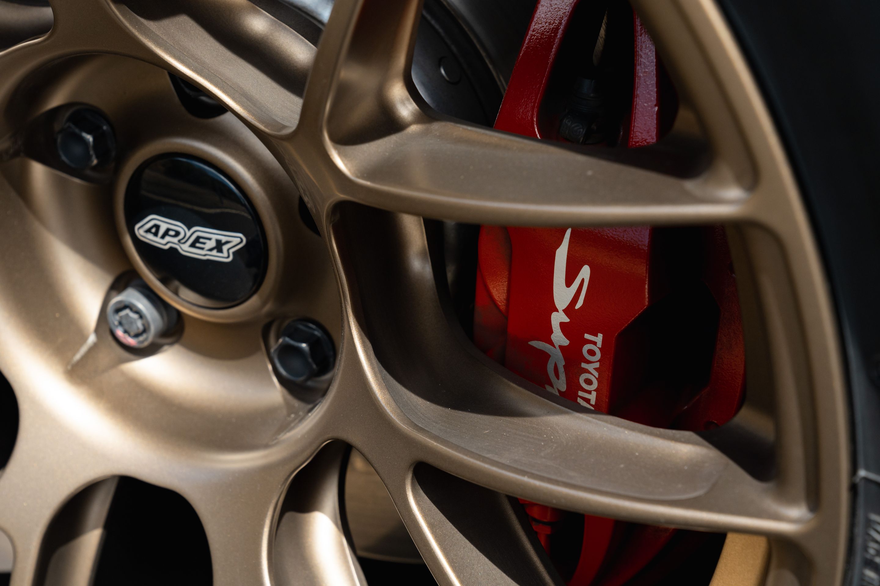 Blue Toyota GR Supra with 18" EC-7RS Apex wheels in Satin Bronze