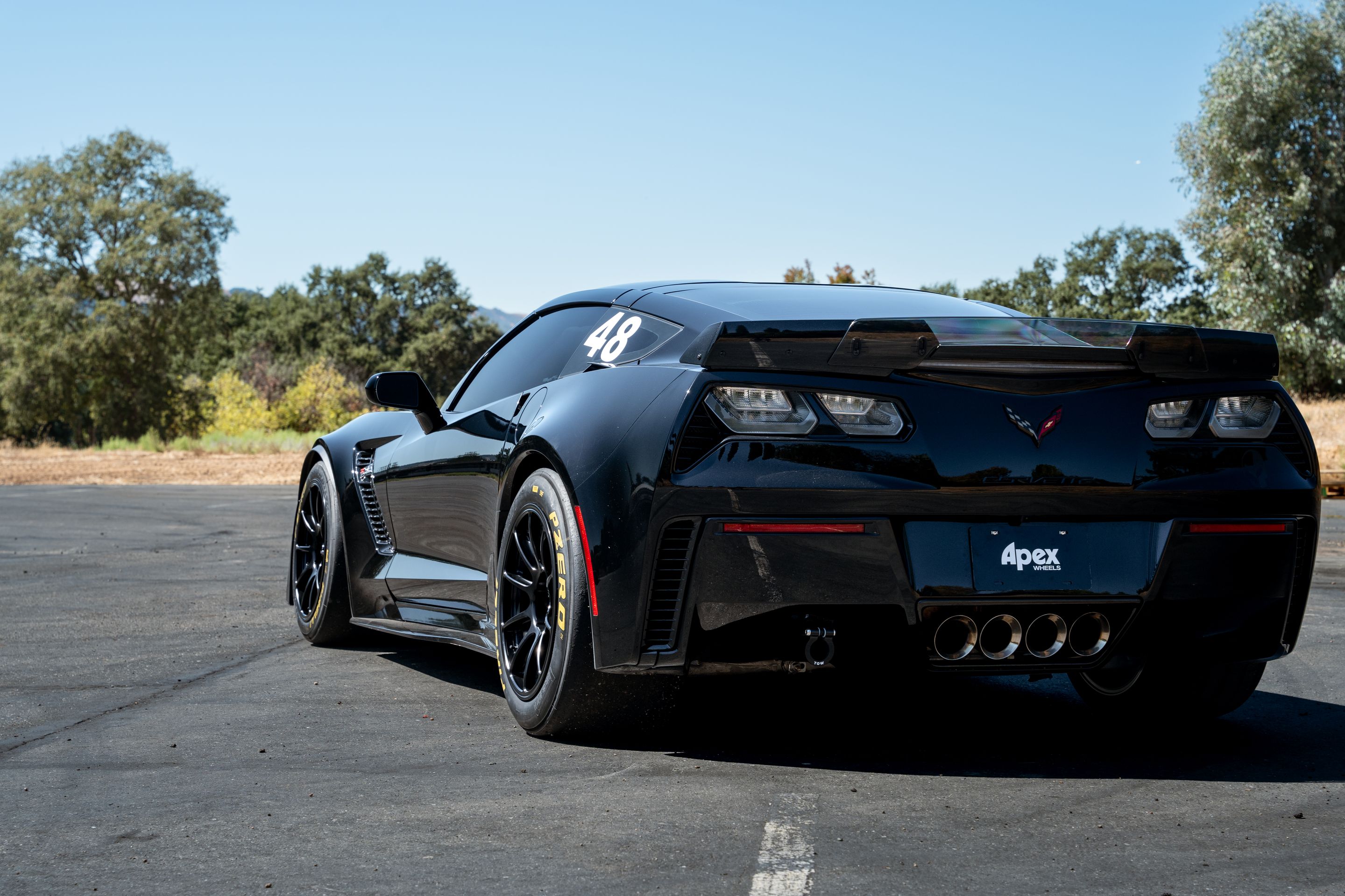 Black Chevrolet C7 Corvette Z06 with 18" SM-10RE Apex wheels in Satin Black