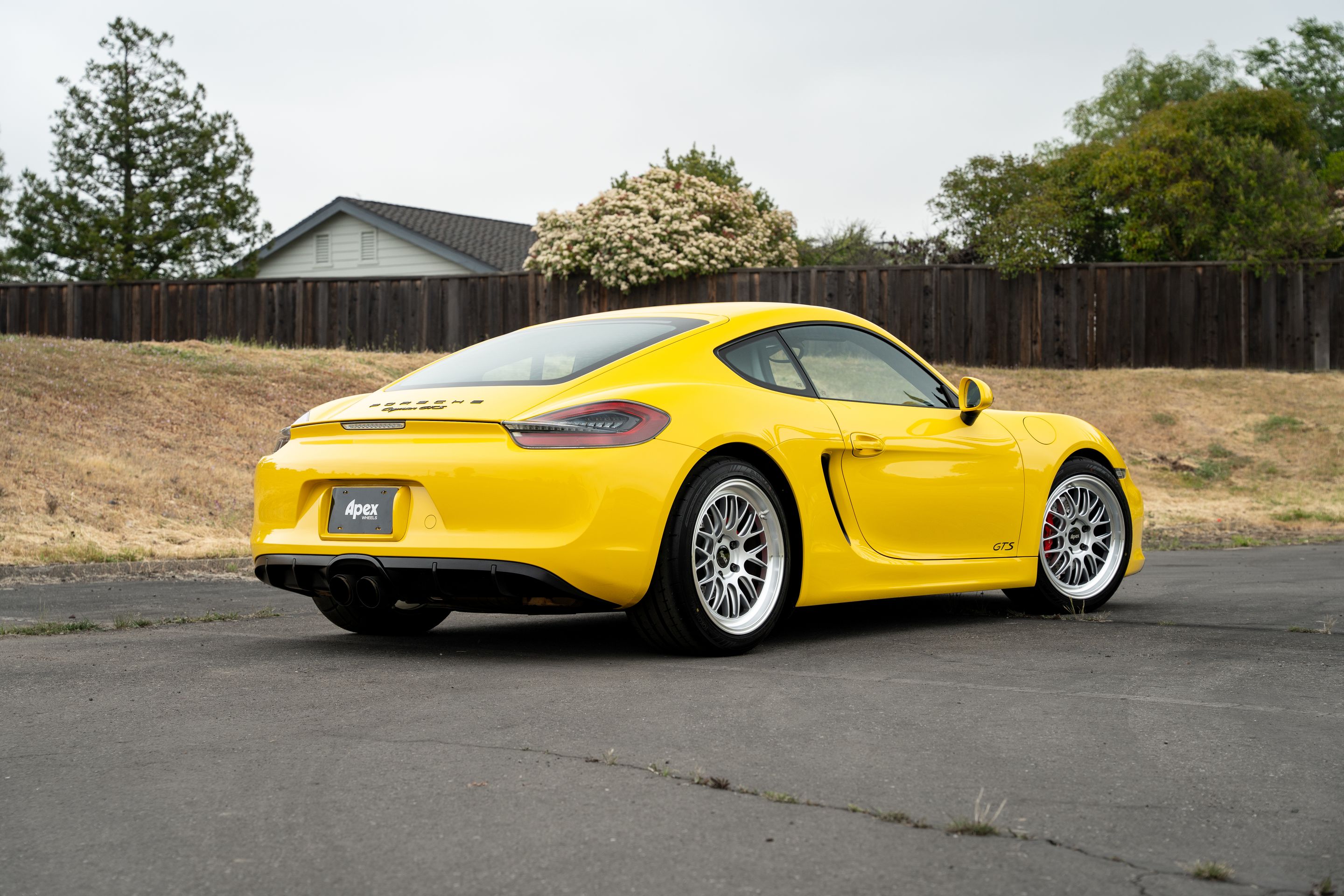 Yellow Porsche 981 Cayman GTS with 19" ML-10RT Apex wheels in Machined Lip Race Silver
