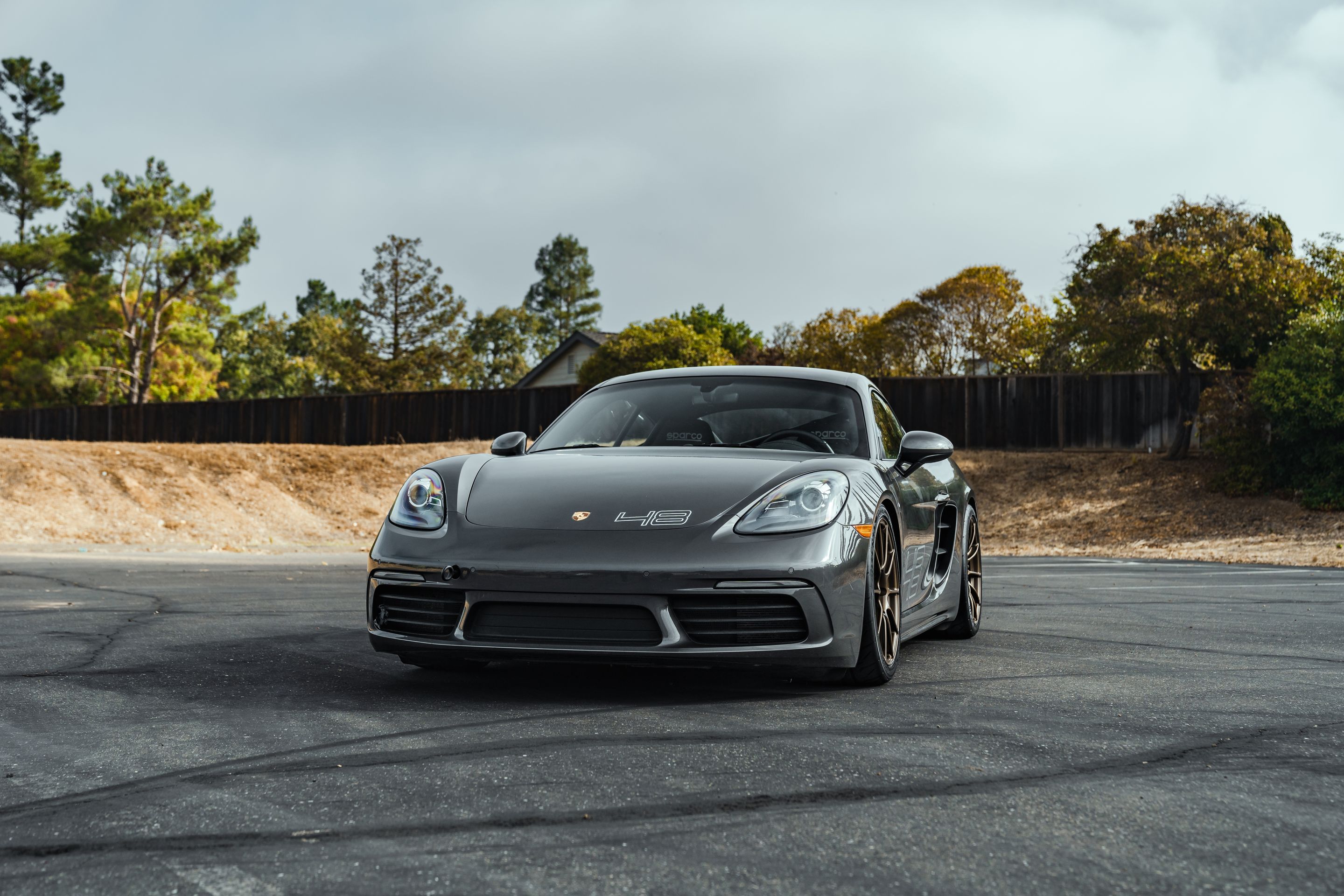 Grey Porsche 718 Cayman S with 19" SM-10RS Apex wheels in Satin Bronze