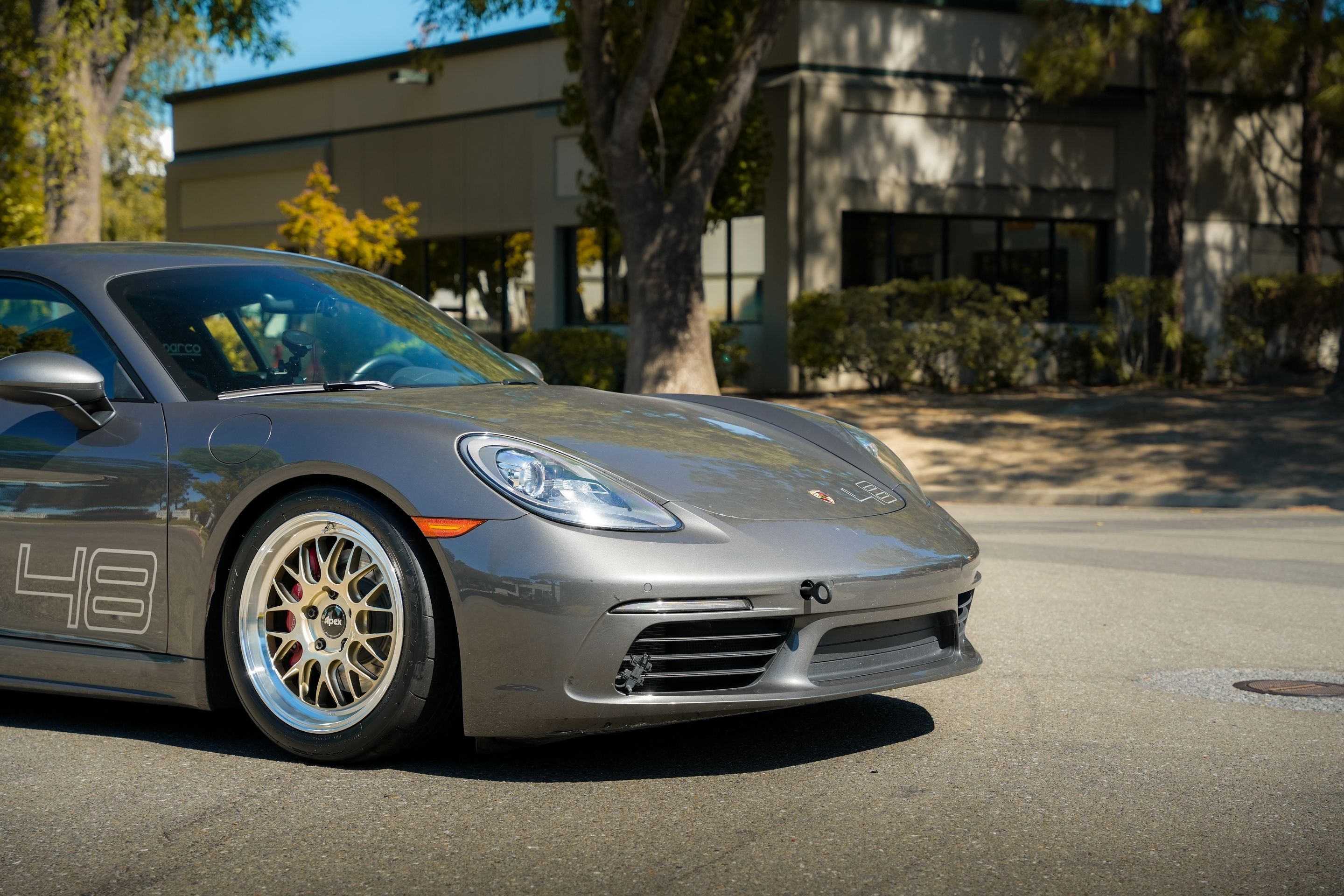 Grey Porsche 718 Cayman S with 18" ML-10RT Apex wheels in Machined Lip Gloss Motorsport Gold