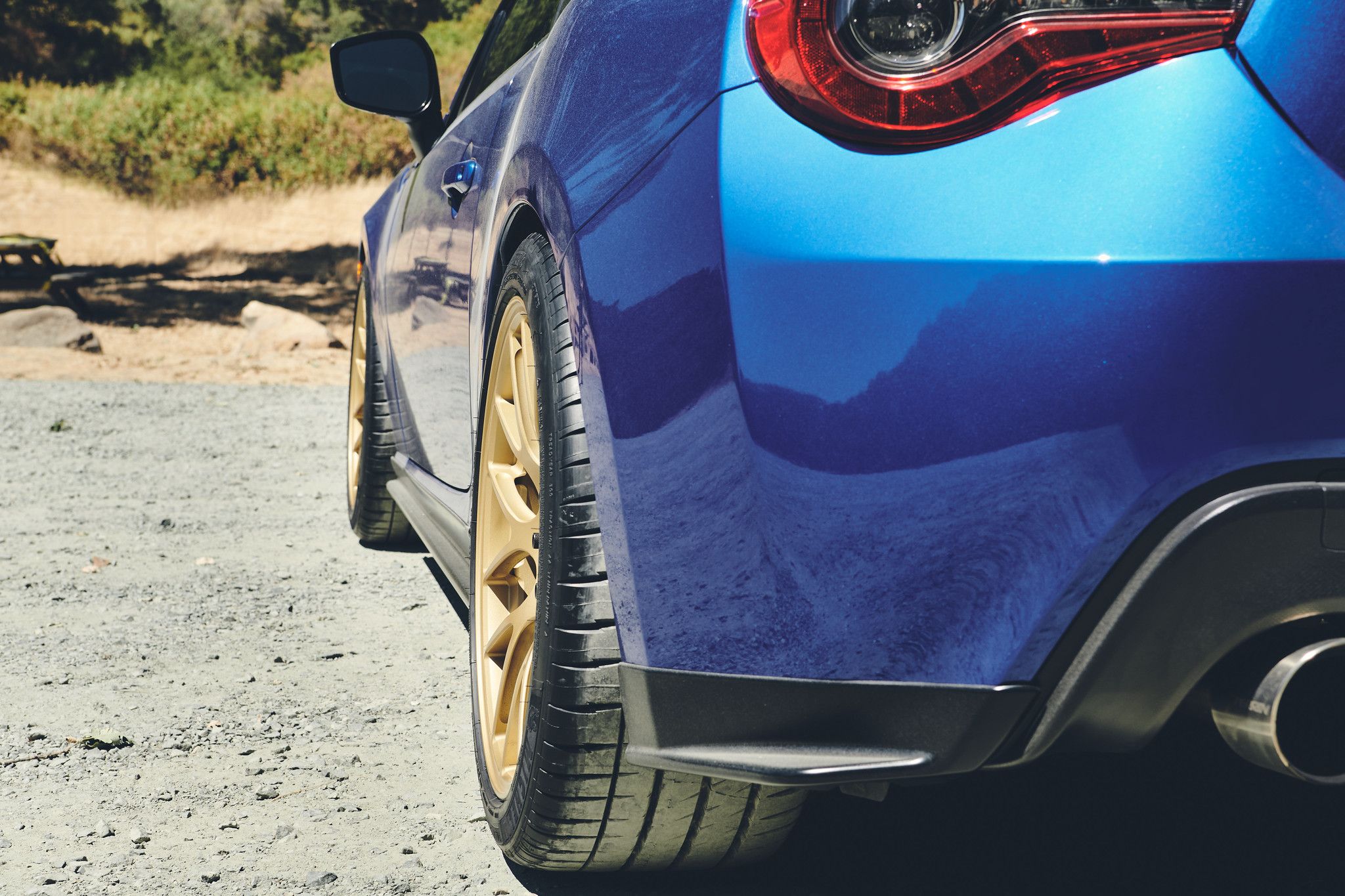 Blue Subaru ZC6 / Gen 1 BRZ with 18" EC-7R Apex wheels in Satin Gold