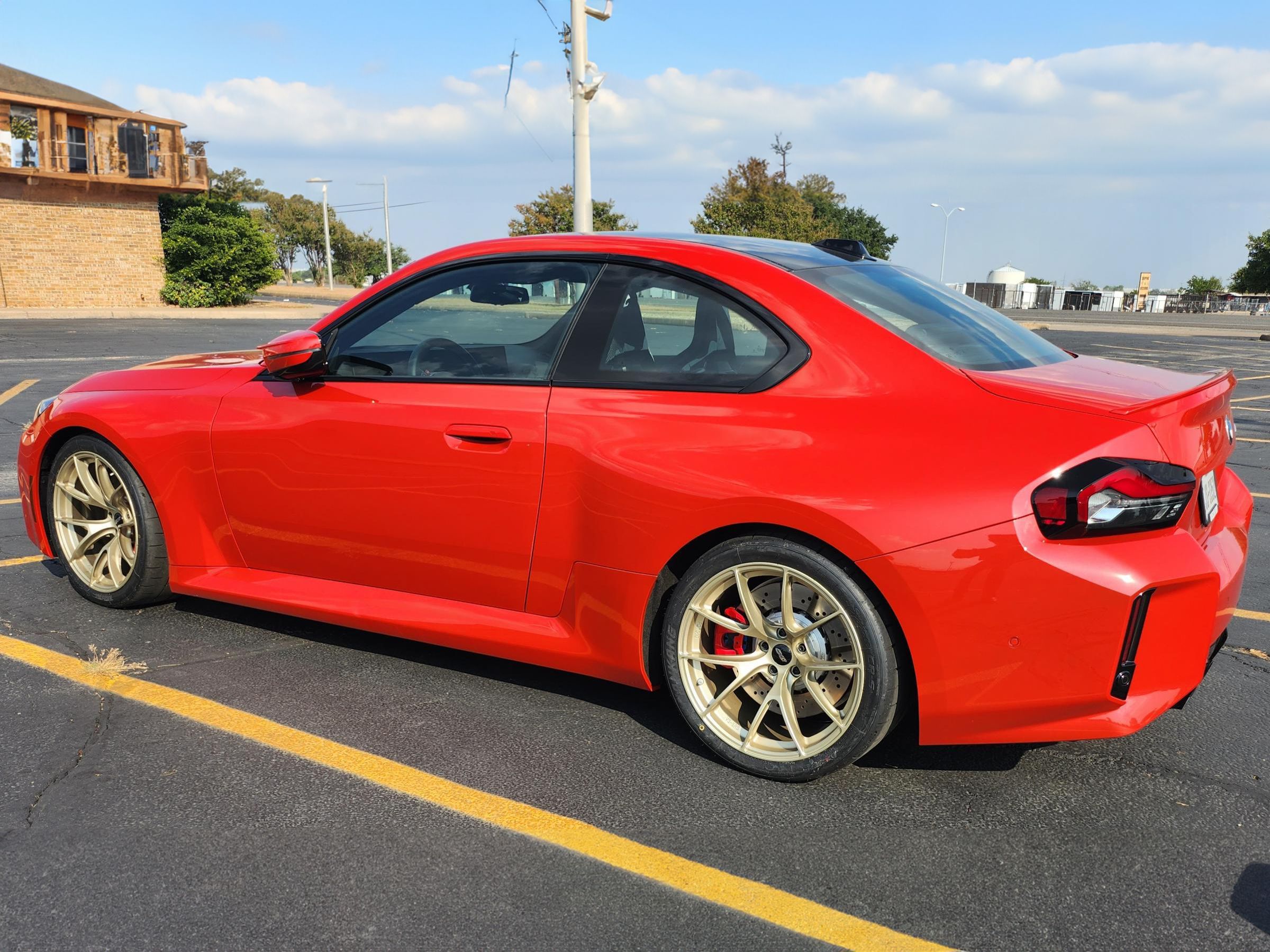 Red BMW G87 M2 with 19" VS-5RS Apex wheels in Motorsport Gold