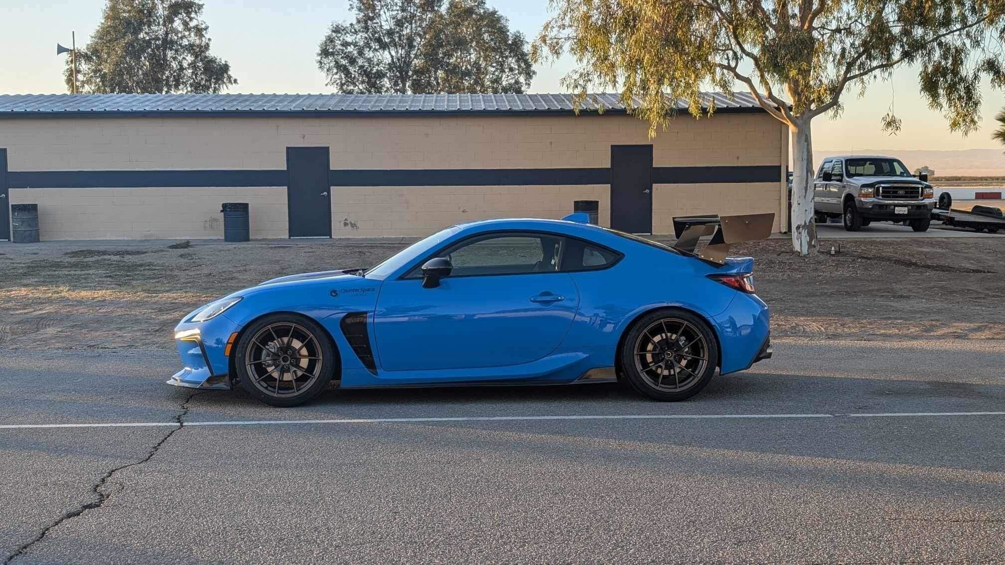 Blue Toyota GR86 with 18" VS-5RS Apex wheels in Satin Bronze