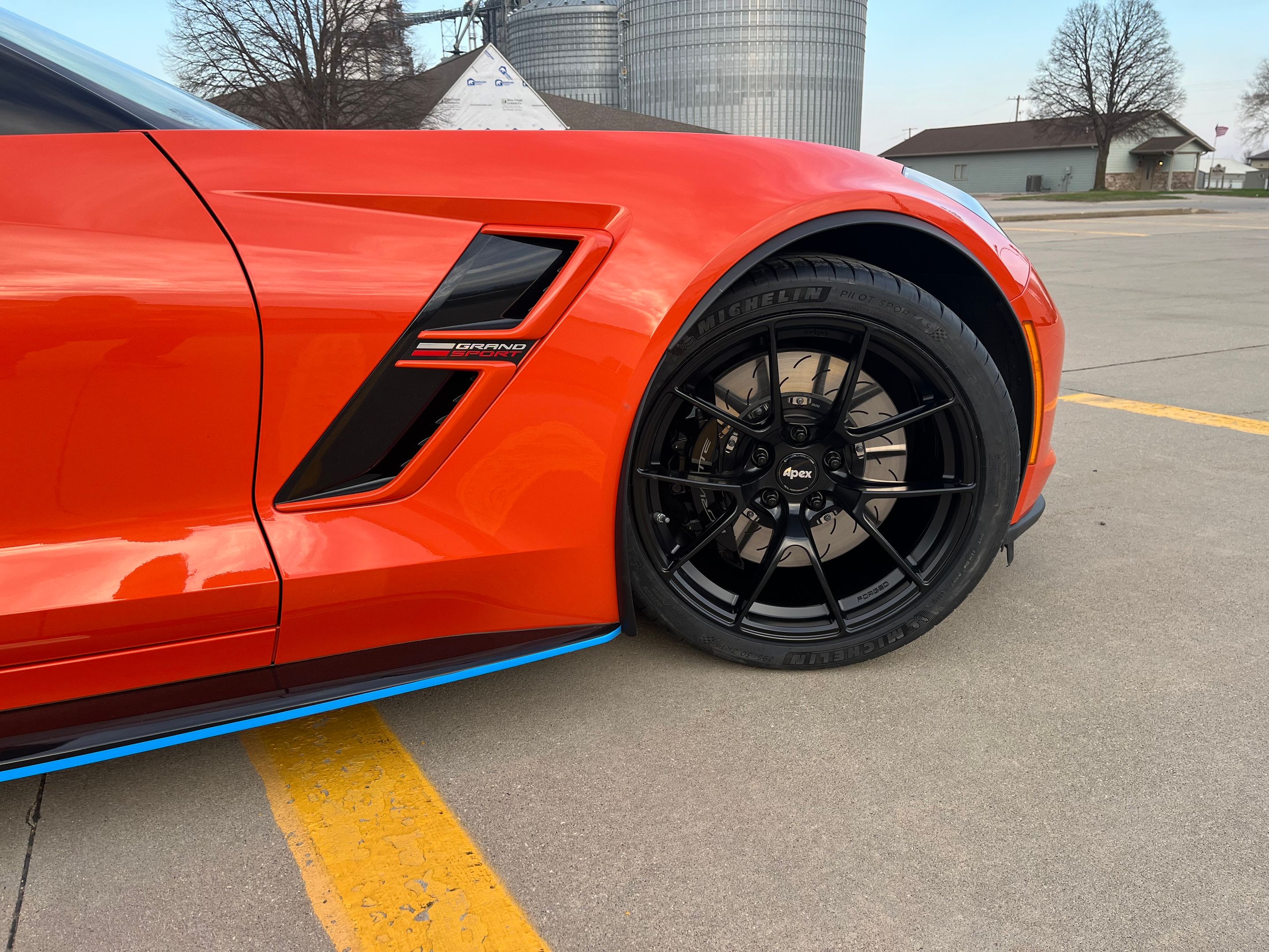 Orange Chevrolet C7 Corvette Grand Sport with 19" VS-5RS Apex wheels in Satin Black