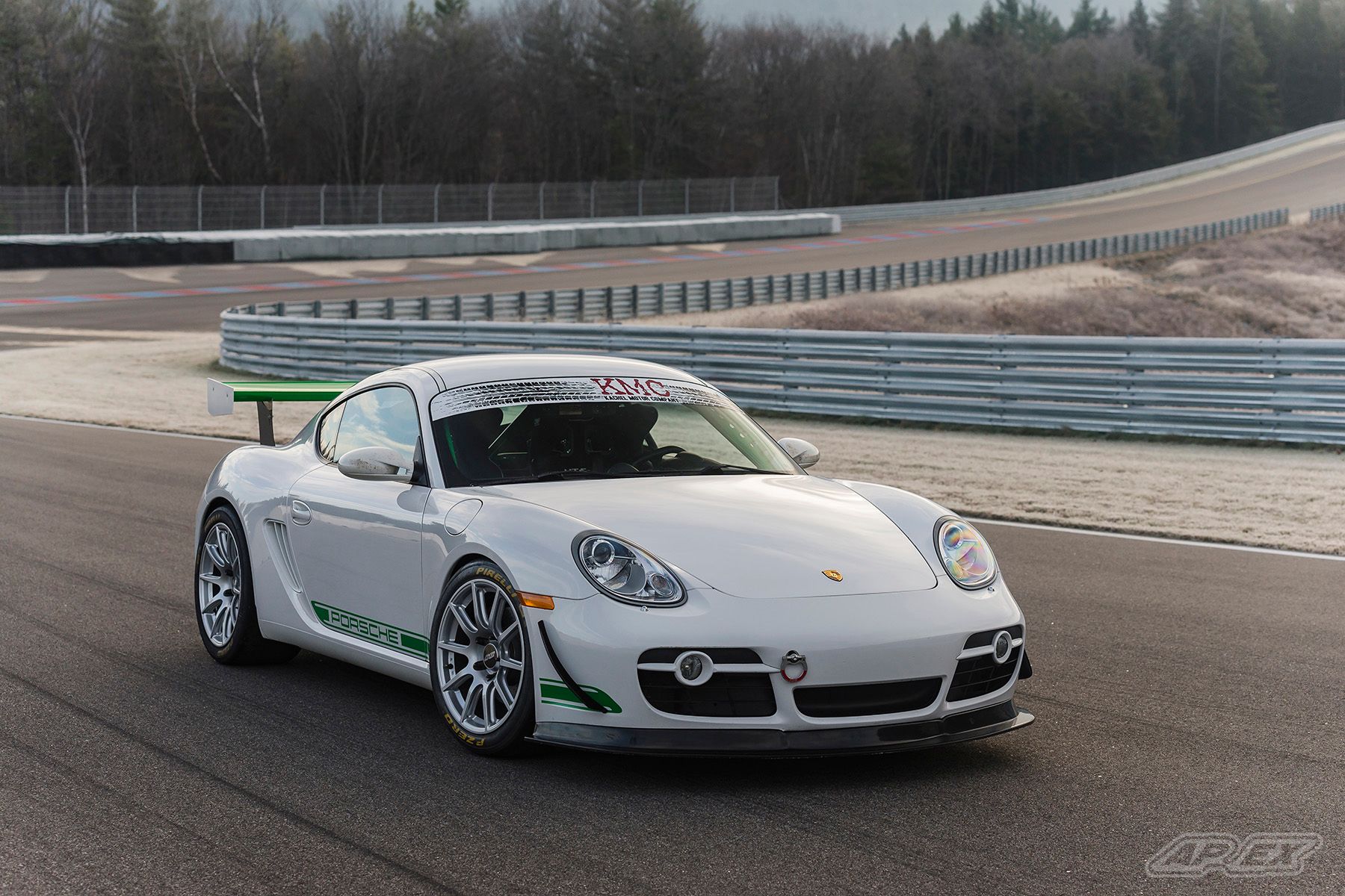 White Porsche 987 Cayman S with 18" SM-10 Apex wheels in Race Silver