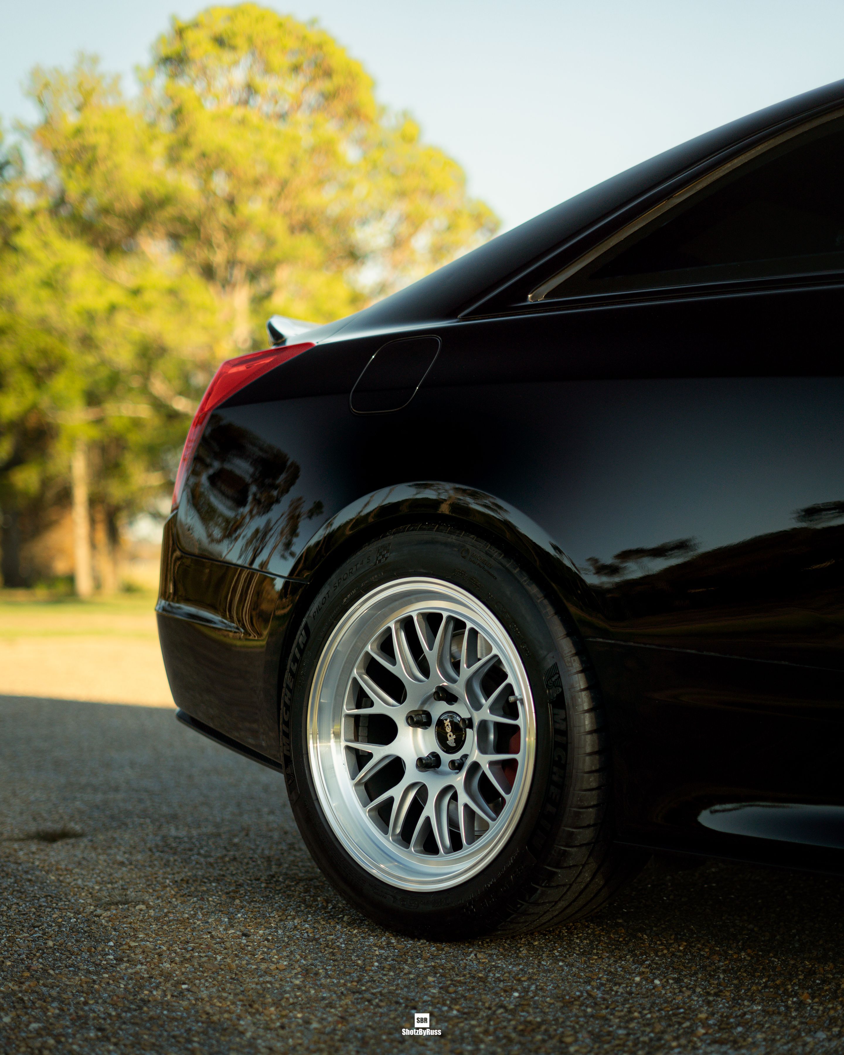 Black Cadillac ATS-V with 18" ML-10RT Apex wheels in Machined Lip Race Silver