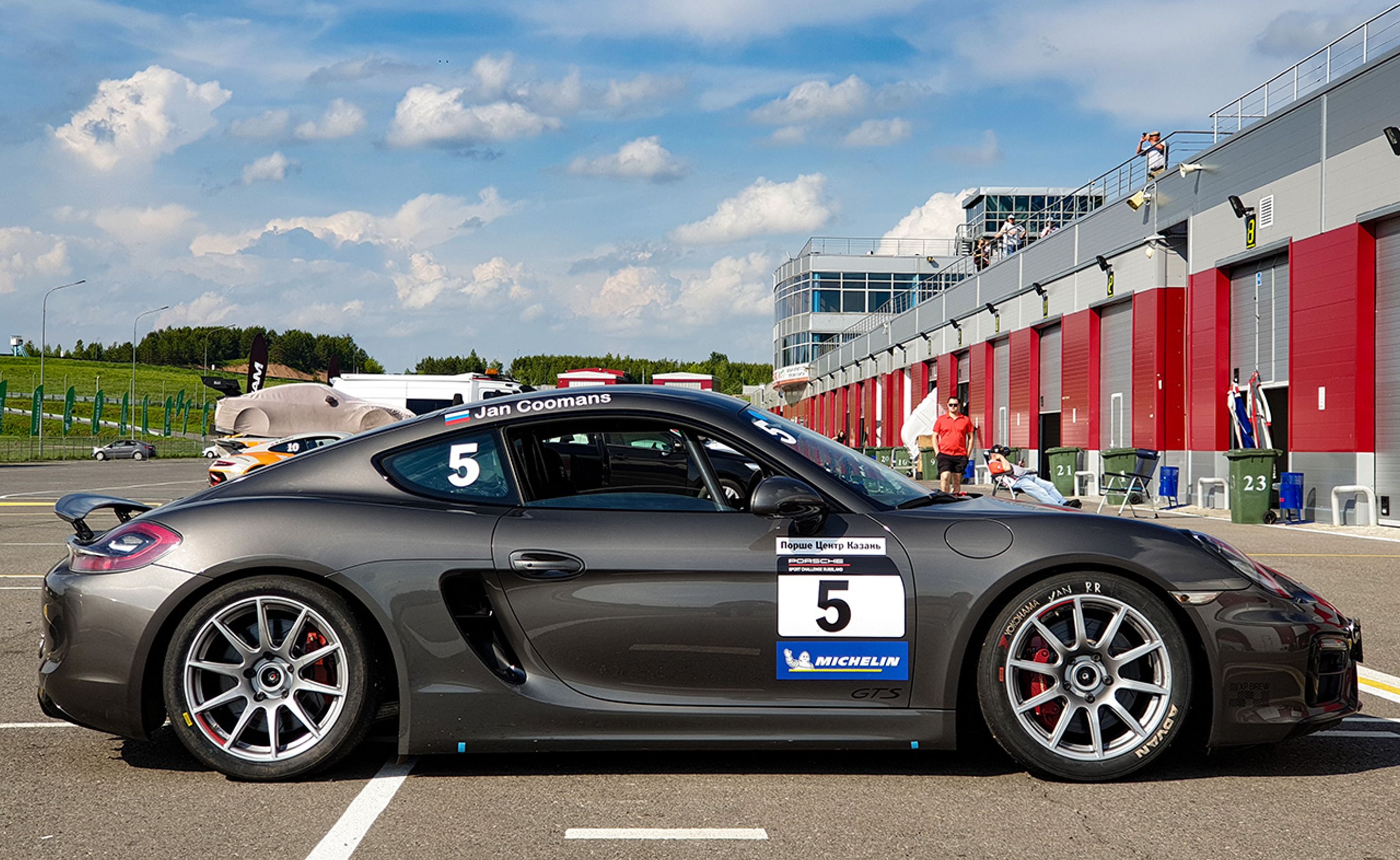 Grey Porsche 981 Cayman GTS with 18" SM-10 Apex wheels in Race Silver