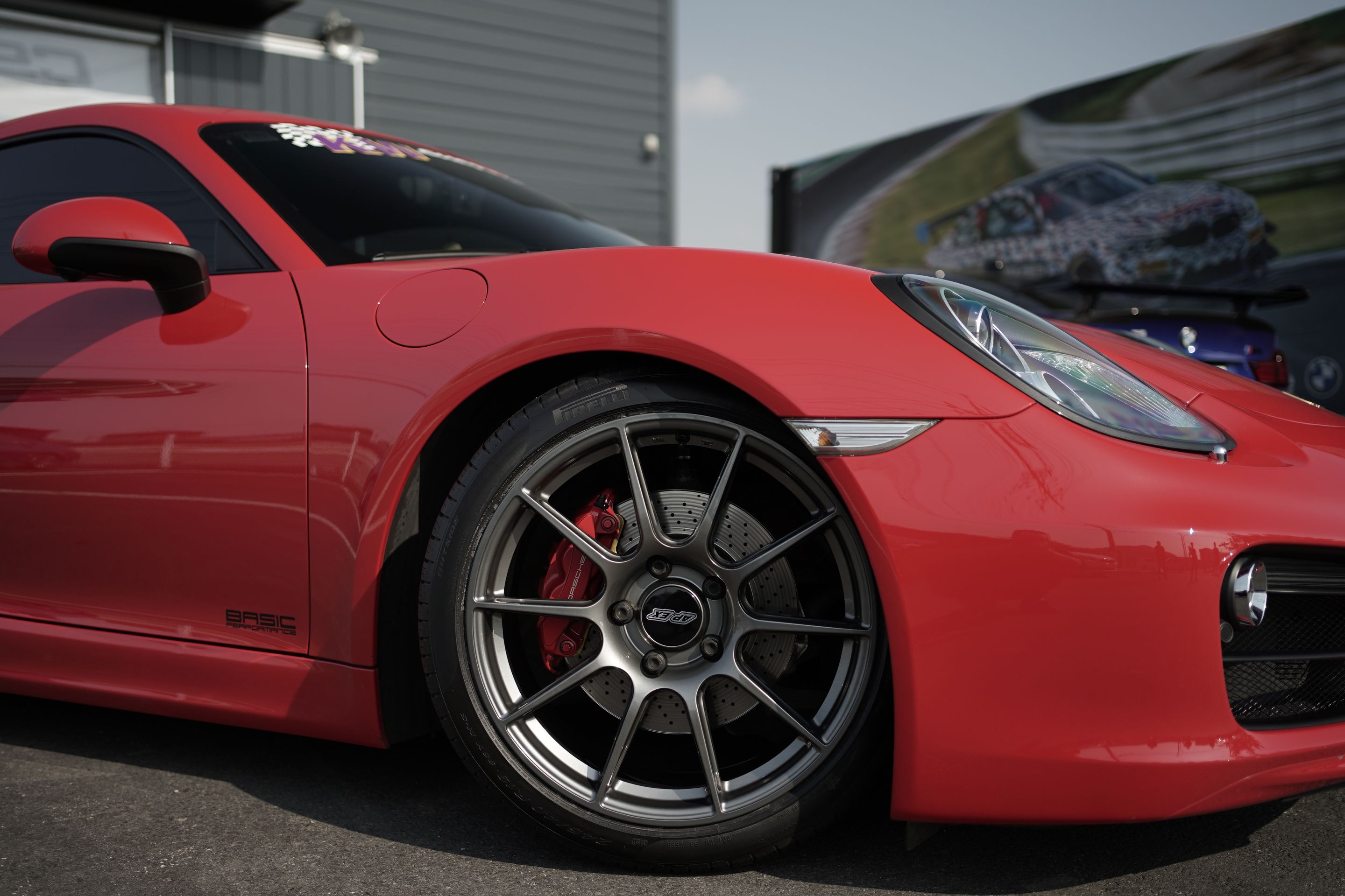 Red Porsche 981 Cayman S with 19" SM-10 Apex wheels in Anthracite