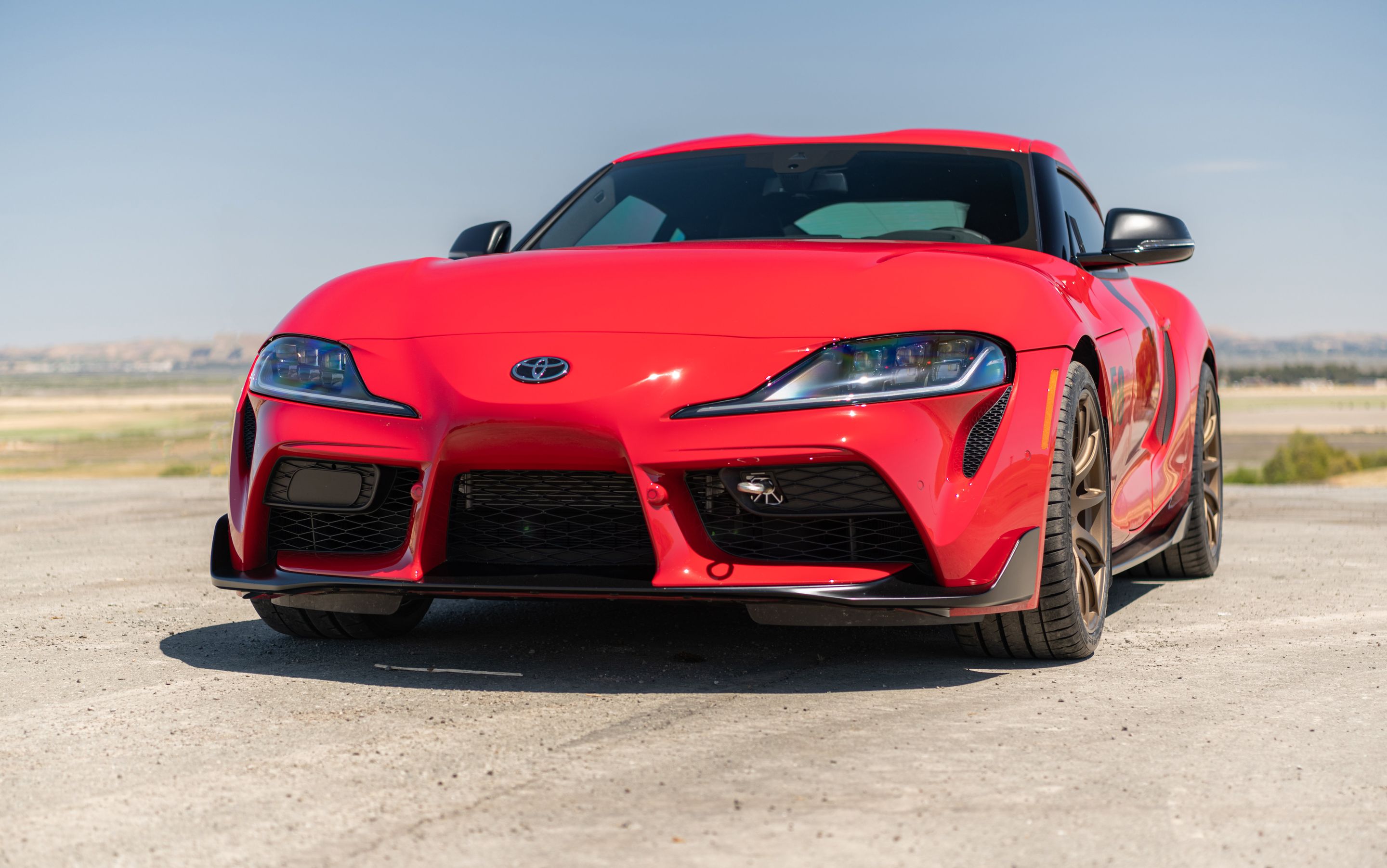 Red Toyota GR Supra with 19" SM-10 Apex wheels in Satin Bronze