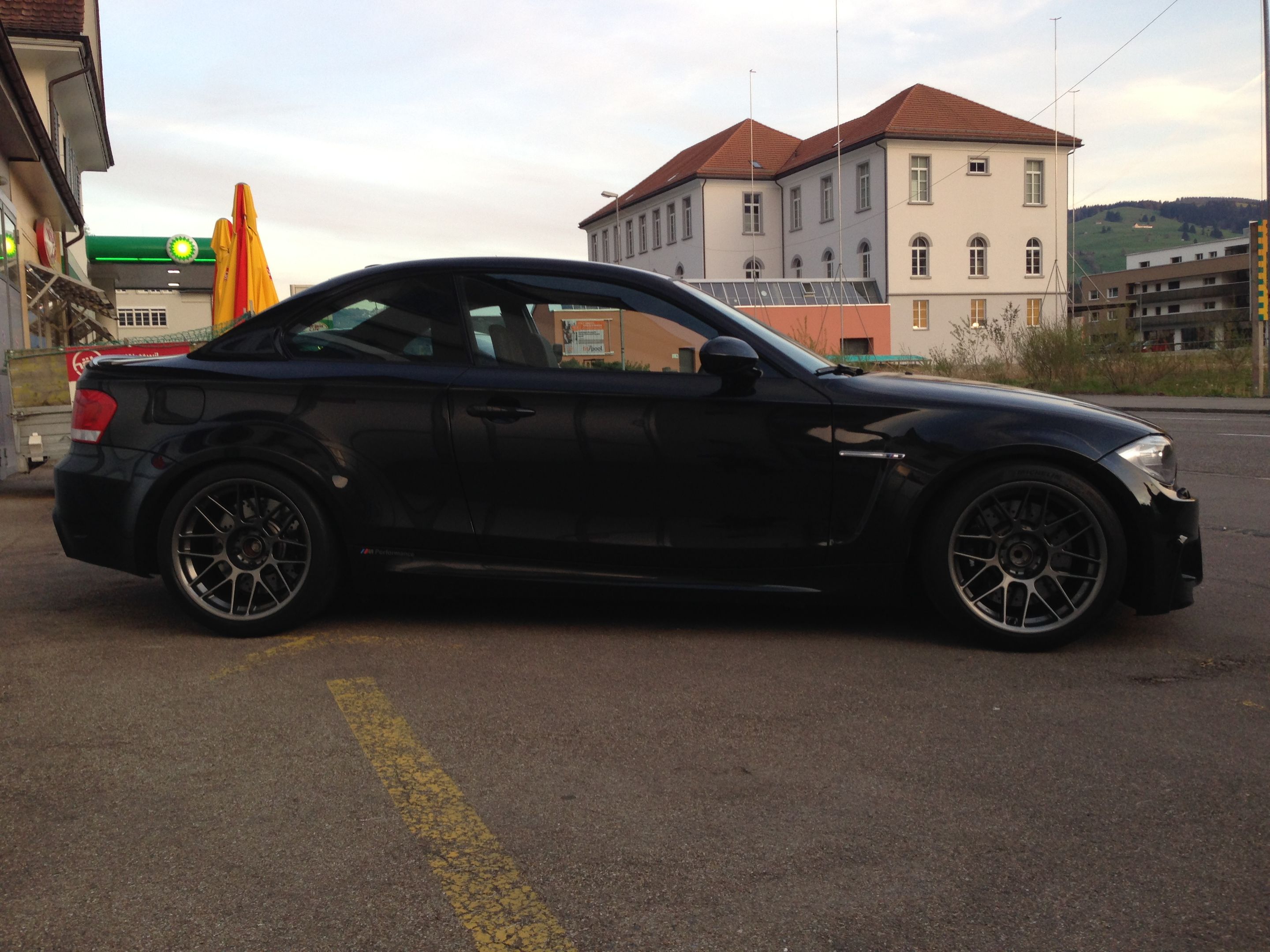Black BMW E82 1M with 18" ARC-8 Apex wheels in Anthracite