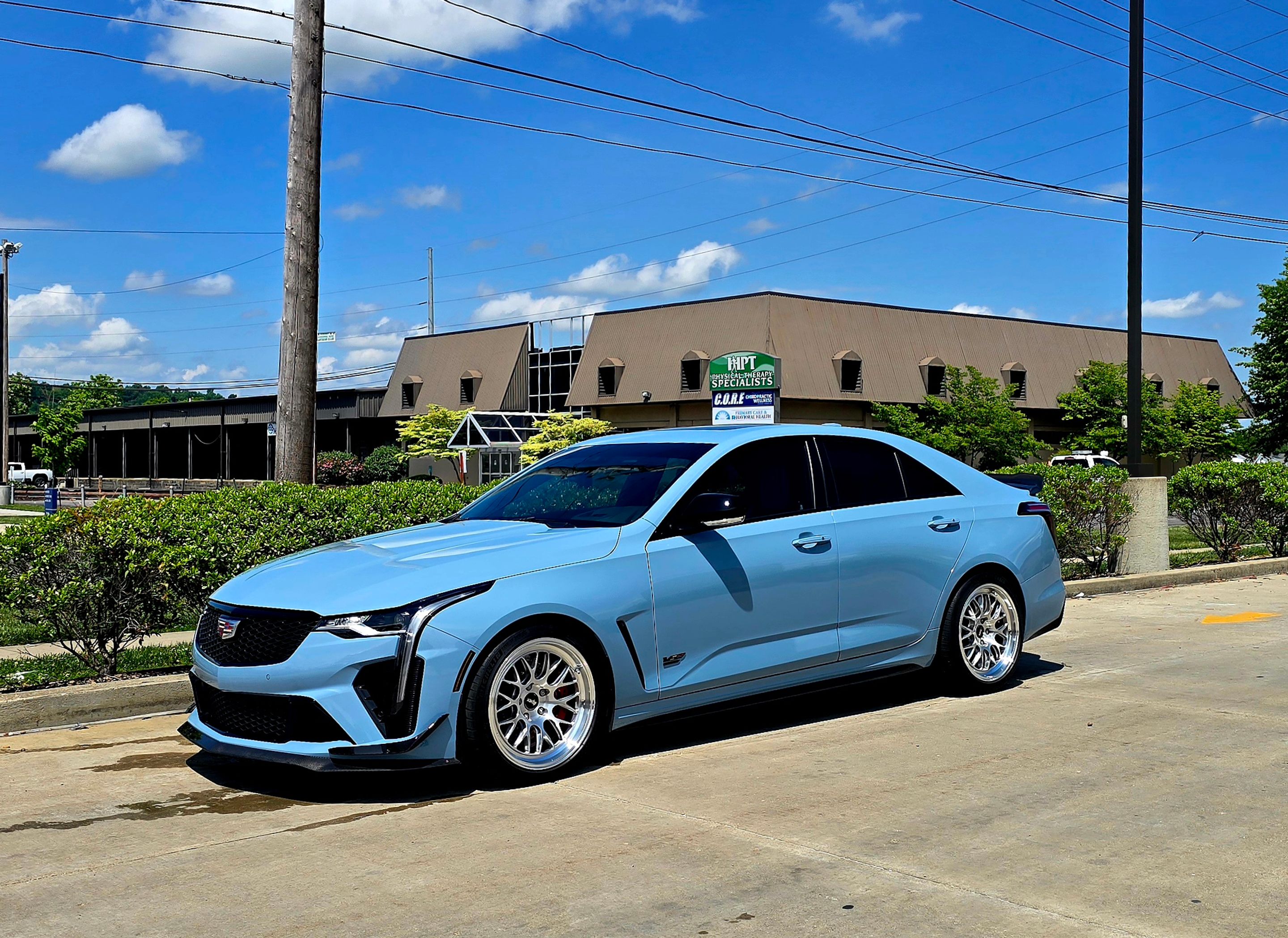 Blue Cadillac CT4-V Blackwing with 18" ML-10RT Apex wheels in Machined Lip Brushed Clear