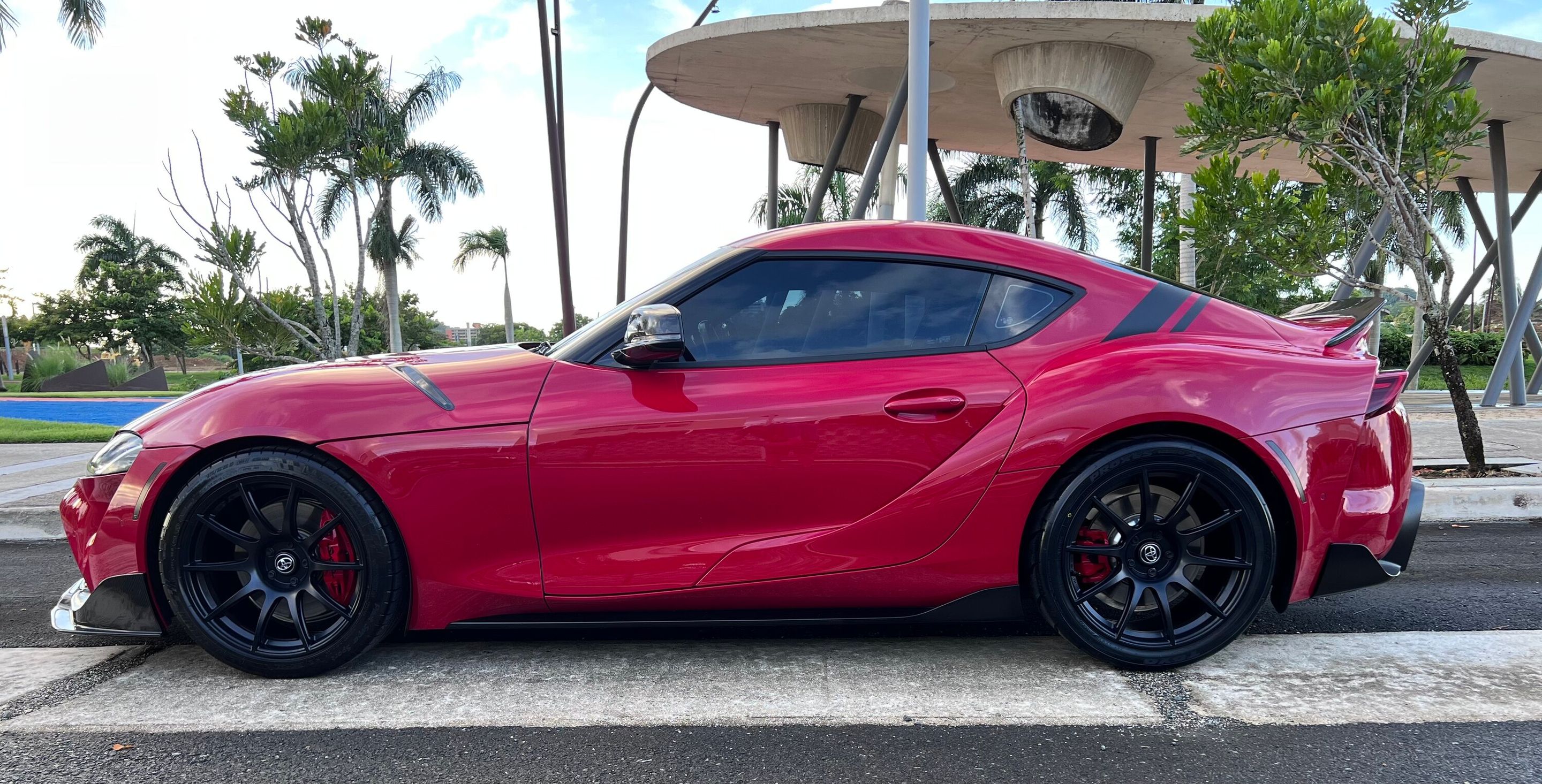 Red Toyota GR Supra with 19" SM-10 Apex wheels in Satin Black