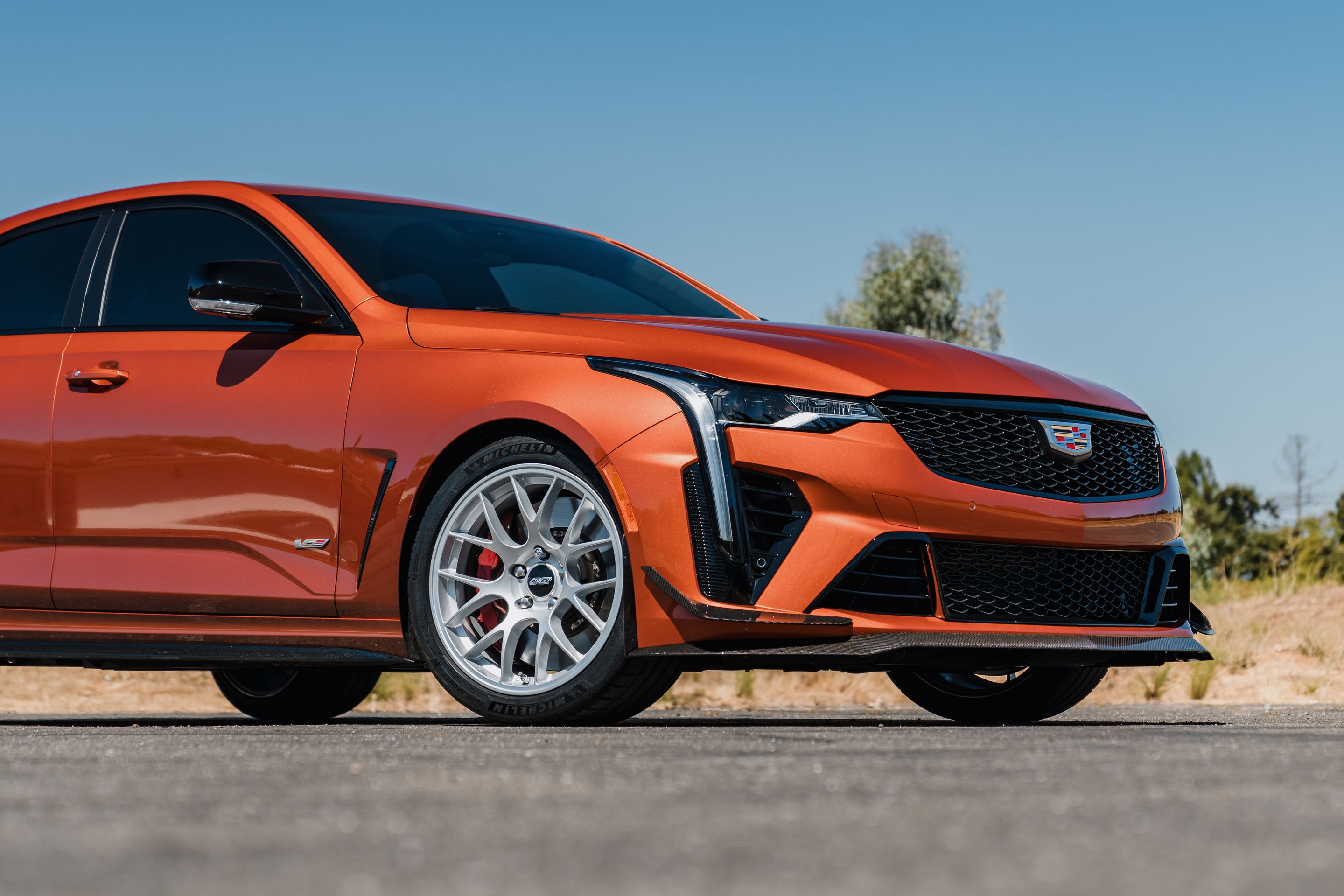 Orange Cadillac CT4-V Blackwing with 18" EC-7 Apex wheels in Race Silver
