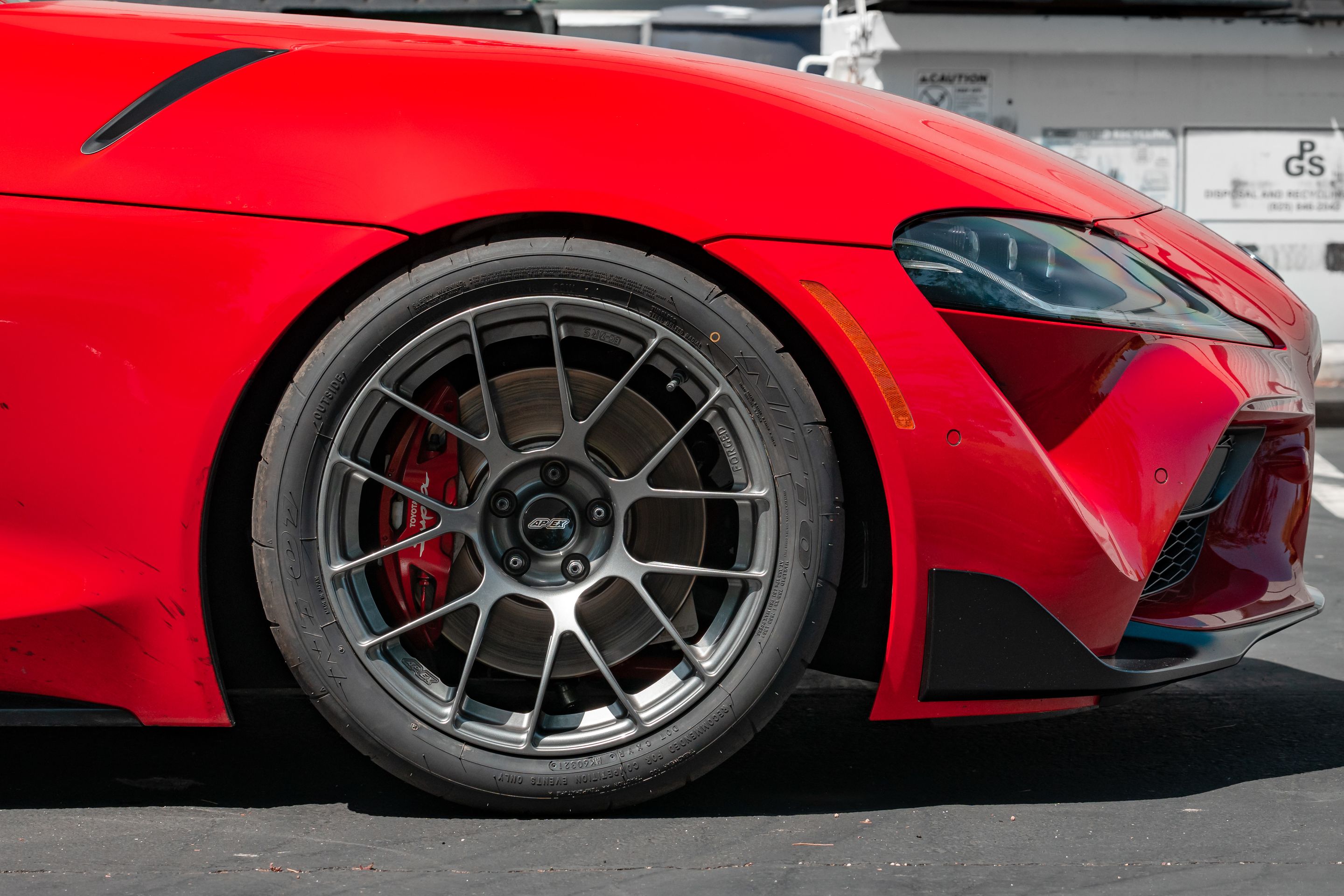 Red Toyota GR Supra with 18" EC-7RS Apex wheels in Anthracite