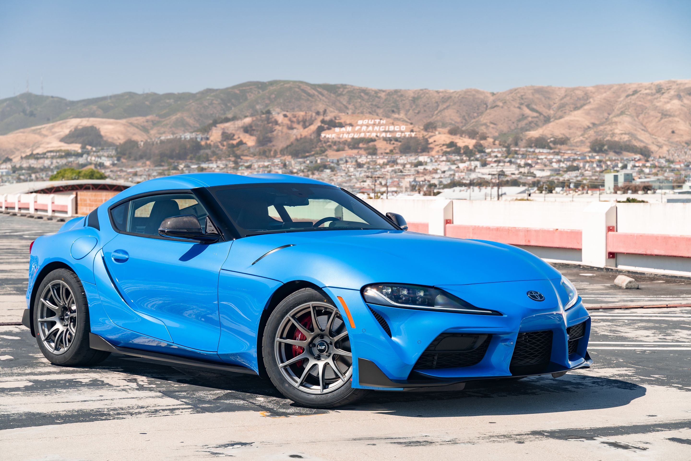 Blue Toyota GR Supra with 18" SM-10 Apex wheels in Anthracite