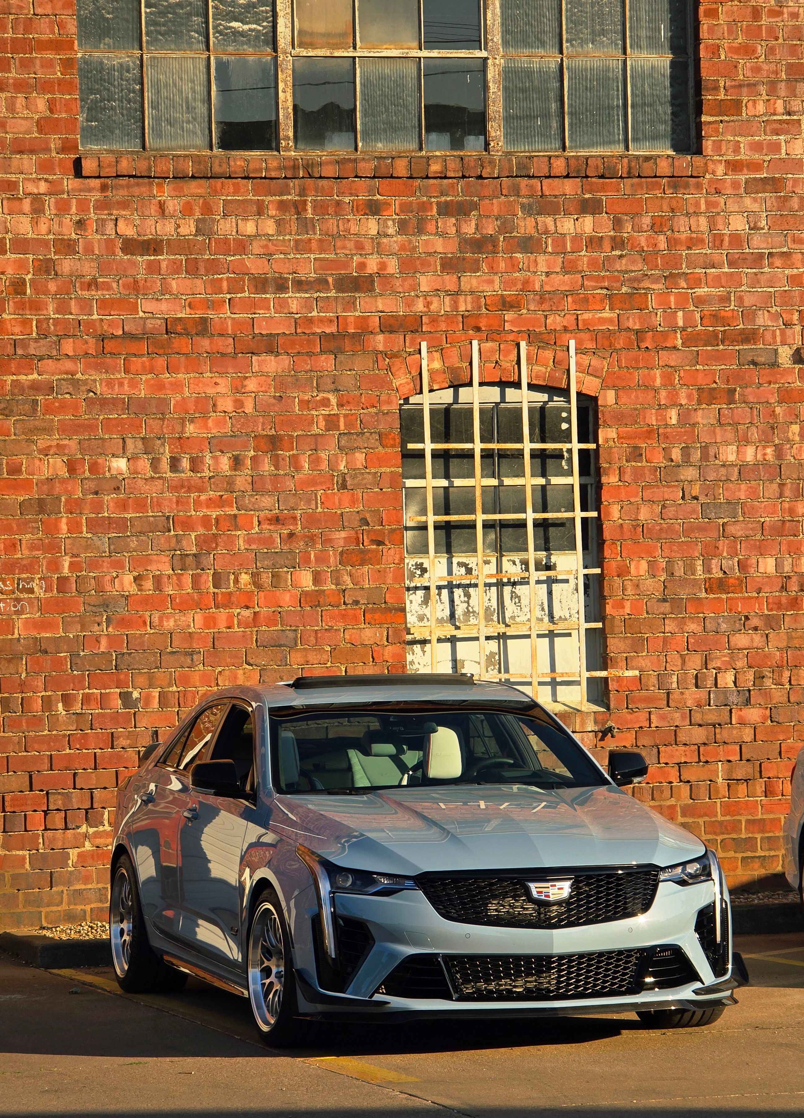 Blue Cadillac CT4-V Blackwing with 18" ML-10RT Apex wheels in Machined Lip Brushed Clear
