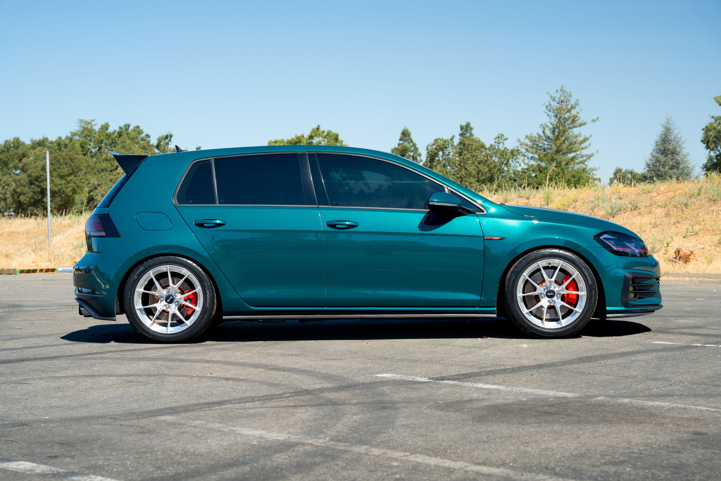 Green VW MK7 GTI with 17" VS-5RS Apex wheels in Brushed Clear