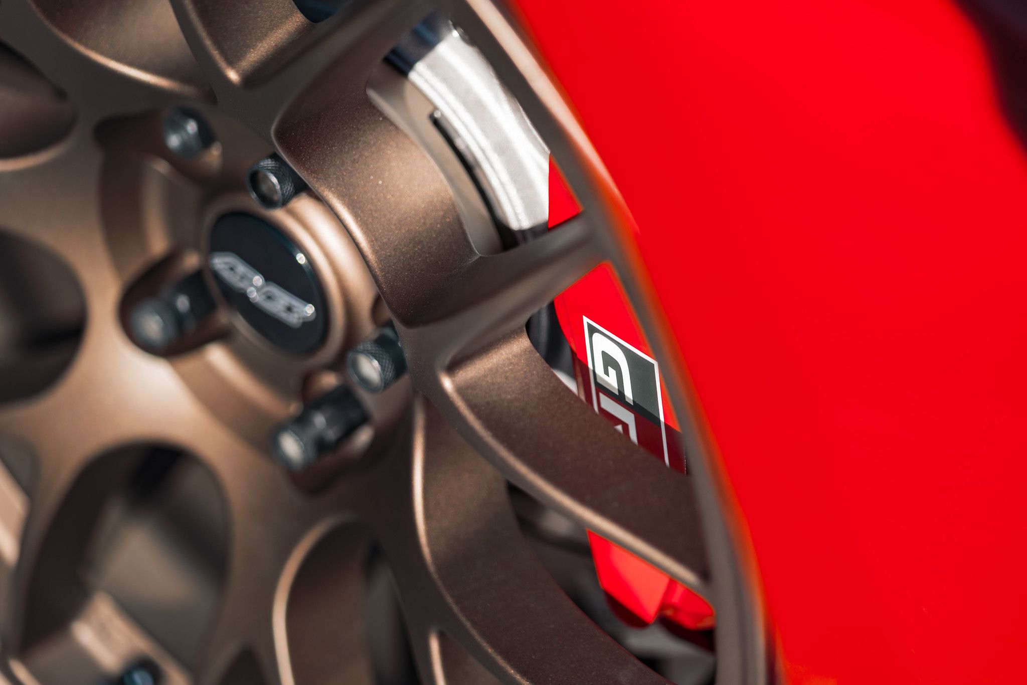 Red Toyota GR Corolla with 18" EC-7 Apex wheels in Satin Bronze