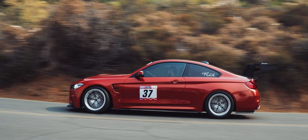 Orange BMW F82 Coupe M4 with 18" VS-5RS Apex wheels in Brushed Clear