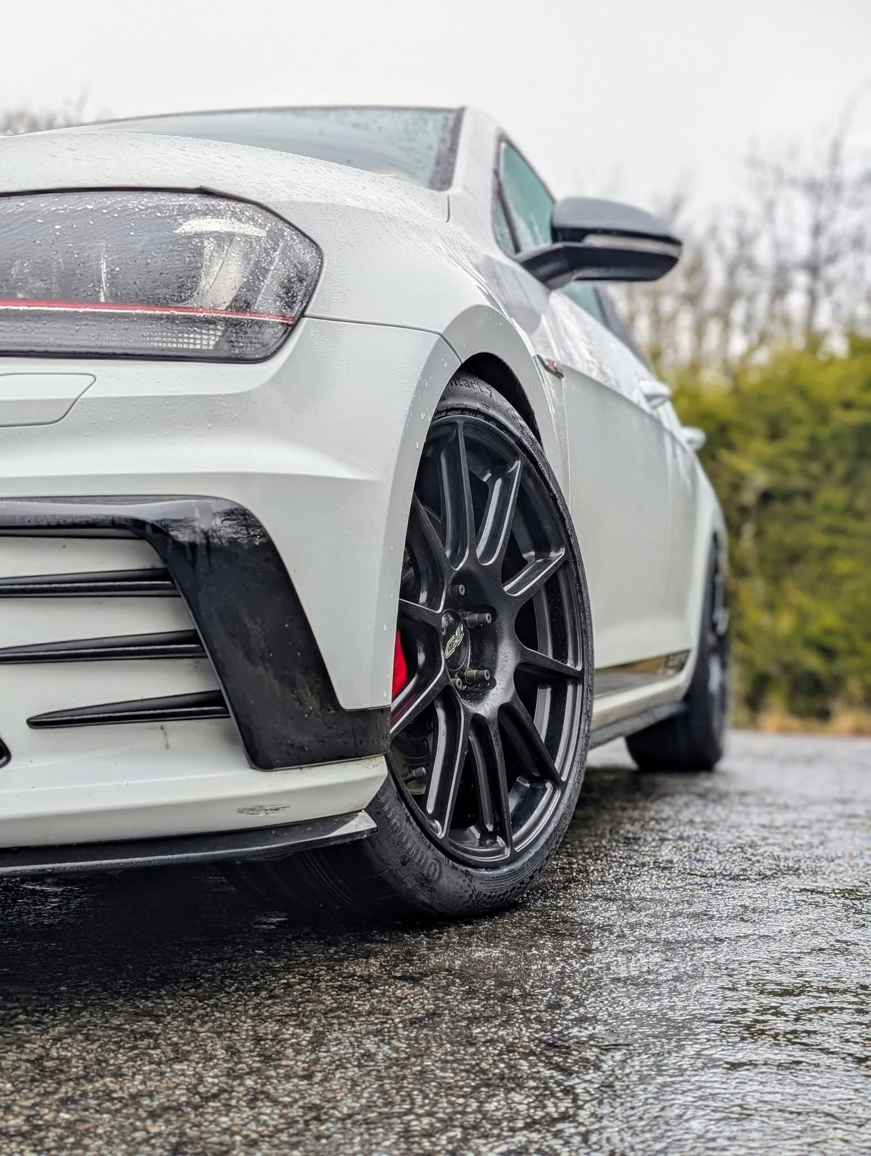 White VW MK7 GTI with 18" SM-10 Apex wheels in Satin Black