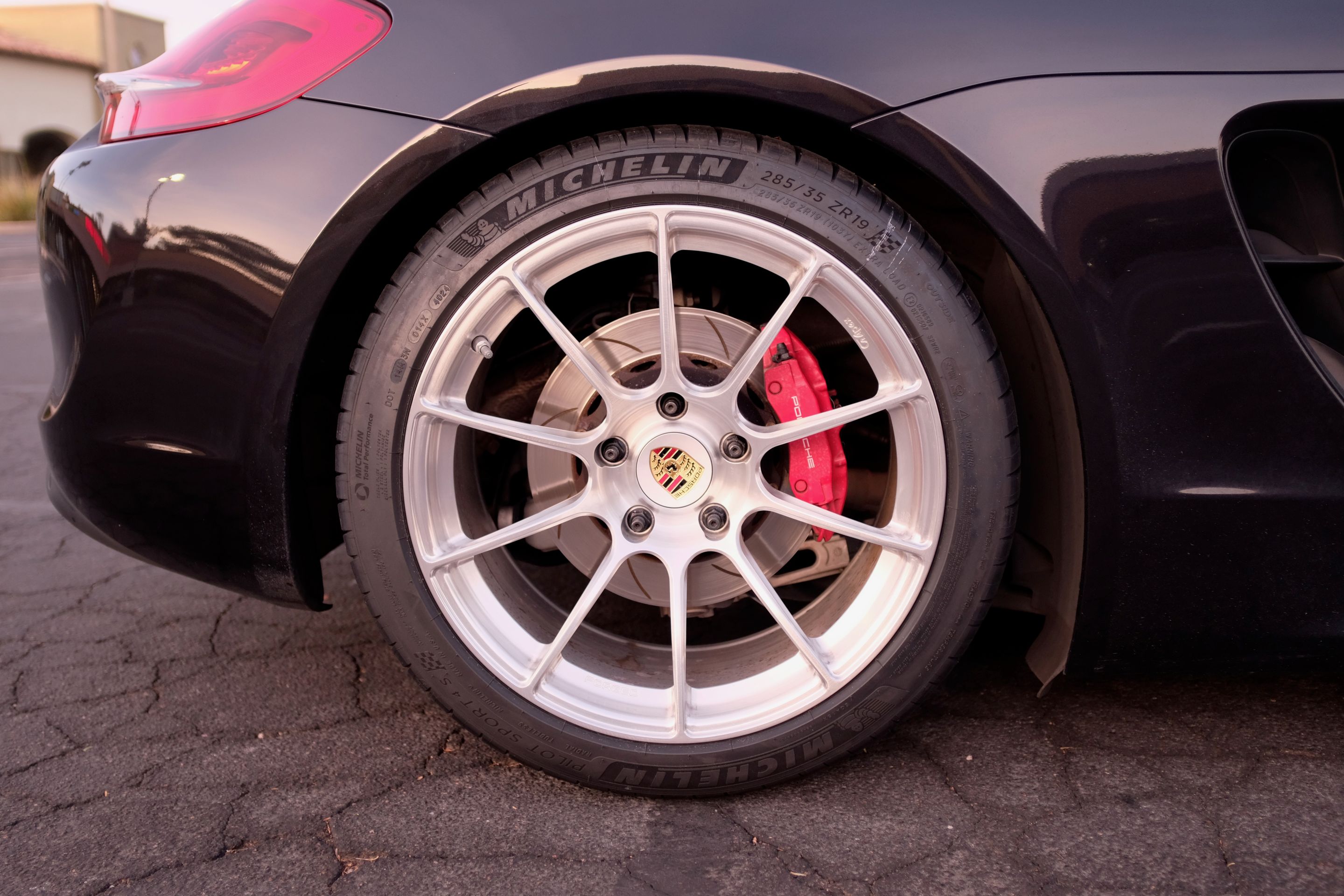 Black Porsche 981 Cayman S with 19" SM-10RS Apex wheels in Brushed Clear